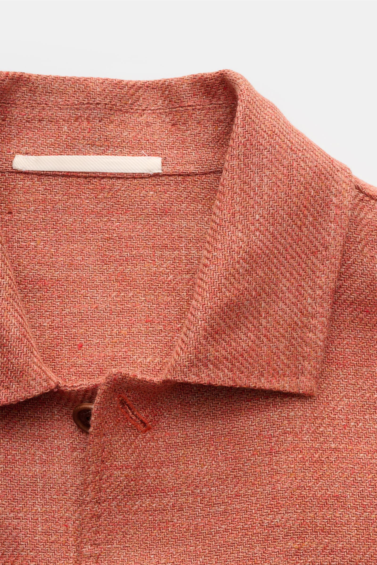Close-up front view of Stile Latino Overshirt 'Gu Texas' orange mottled, showing its linen-cotton blend fabric, turn-down collar, and five-button placket. Luxurious layers: This sophisticated overshirt by STILE LATINO combines exquisite quality with timel
