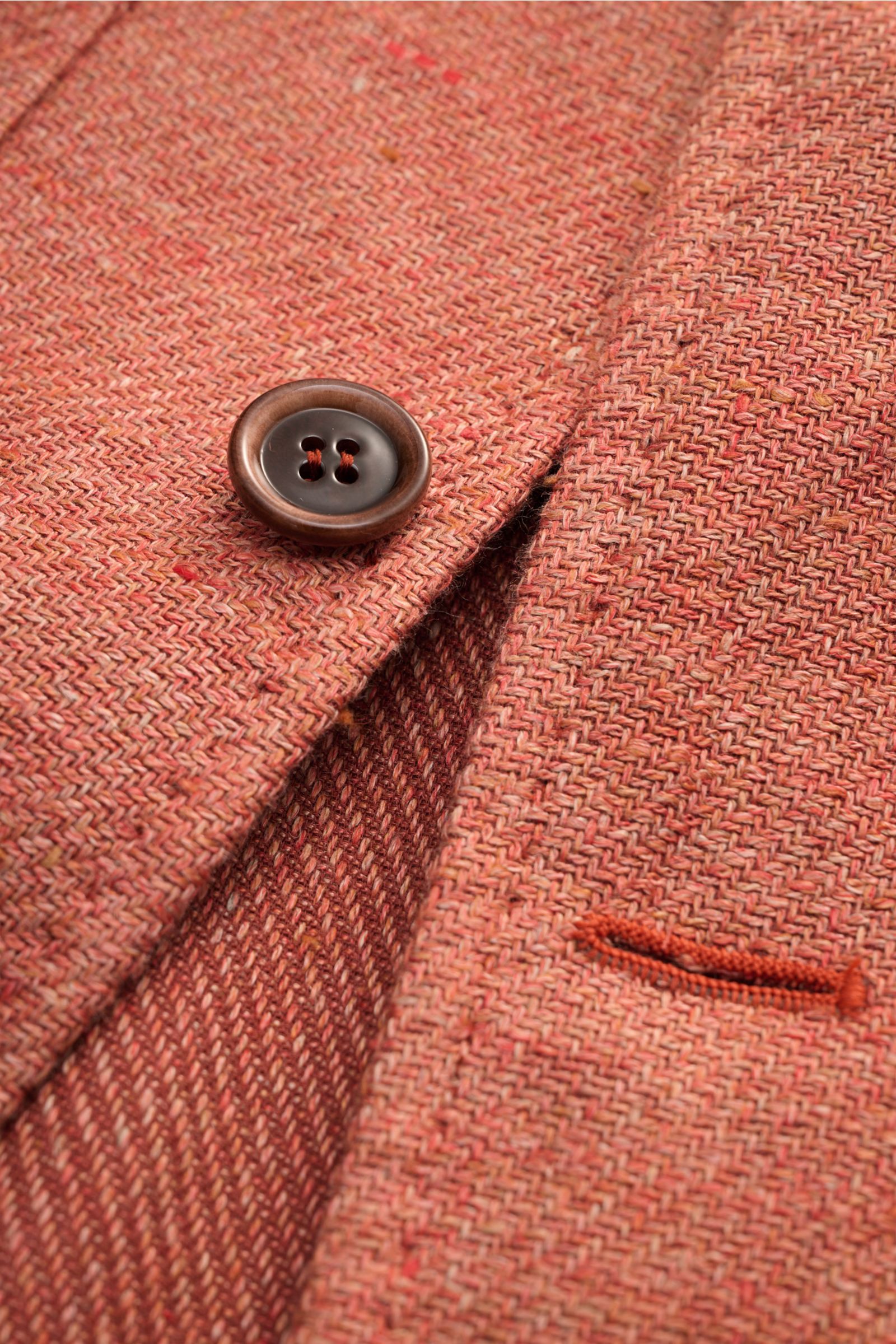 Close-up front detail of Stile Latino Overshirt 'Gu Texas' orange mottled showing woven linen-cotton fabric, button, and buttonhole, photographed from above. Luxurious layers: This sophisticated overshirt by STILE LATINO combines exquisite quality with ti