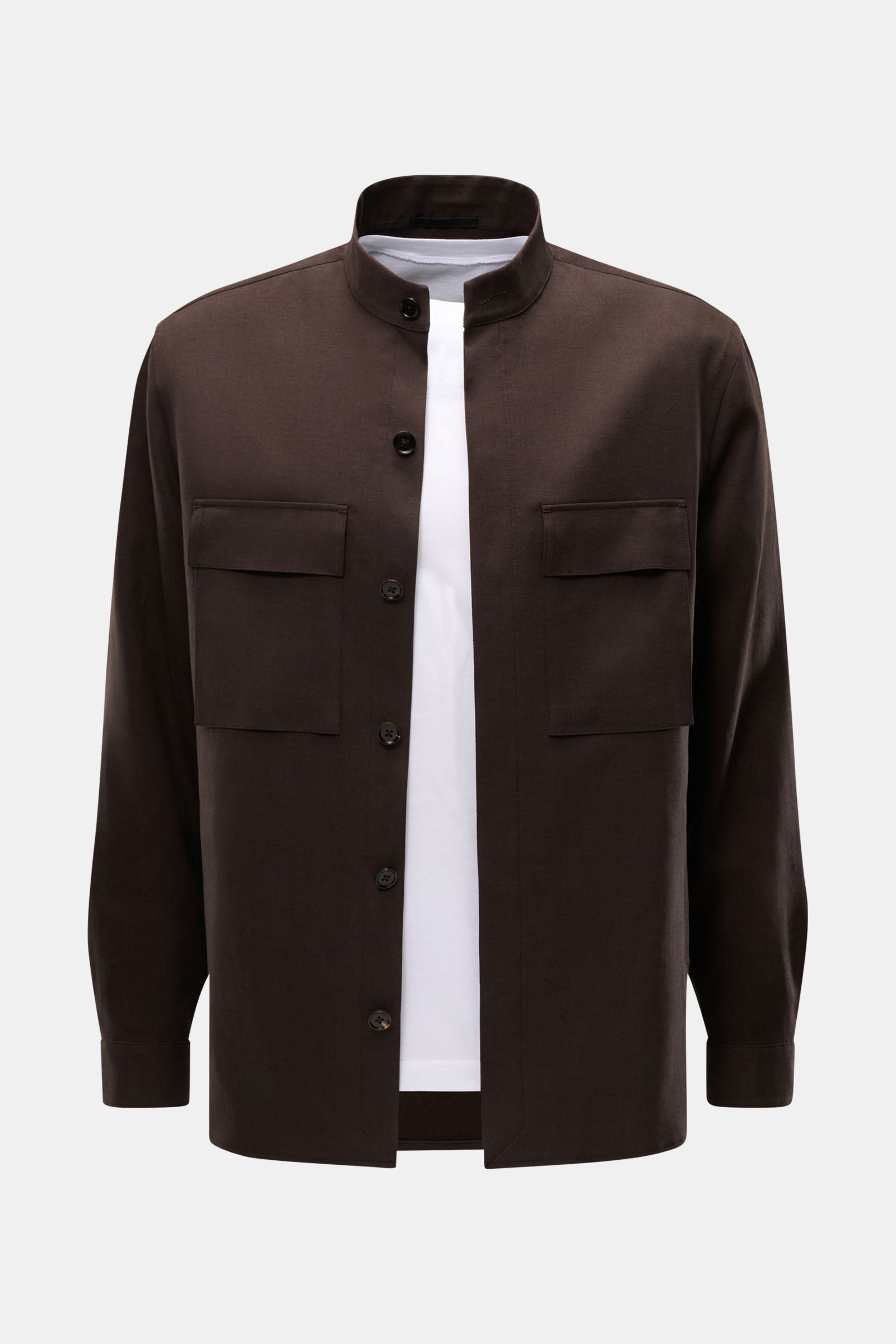 Zegna Linen overshirt dark brown shown from the front, featuring a grandad collar, concealed six-button placket, patch breast pockets with flap, cuffs with button, slanted hip pockets, short hem vents, and one inside pocket. 

Minimalism from ZEGNA: Th