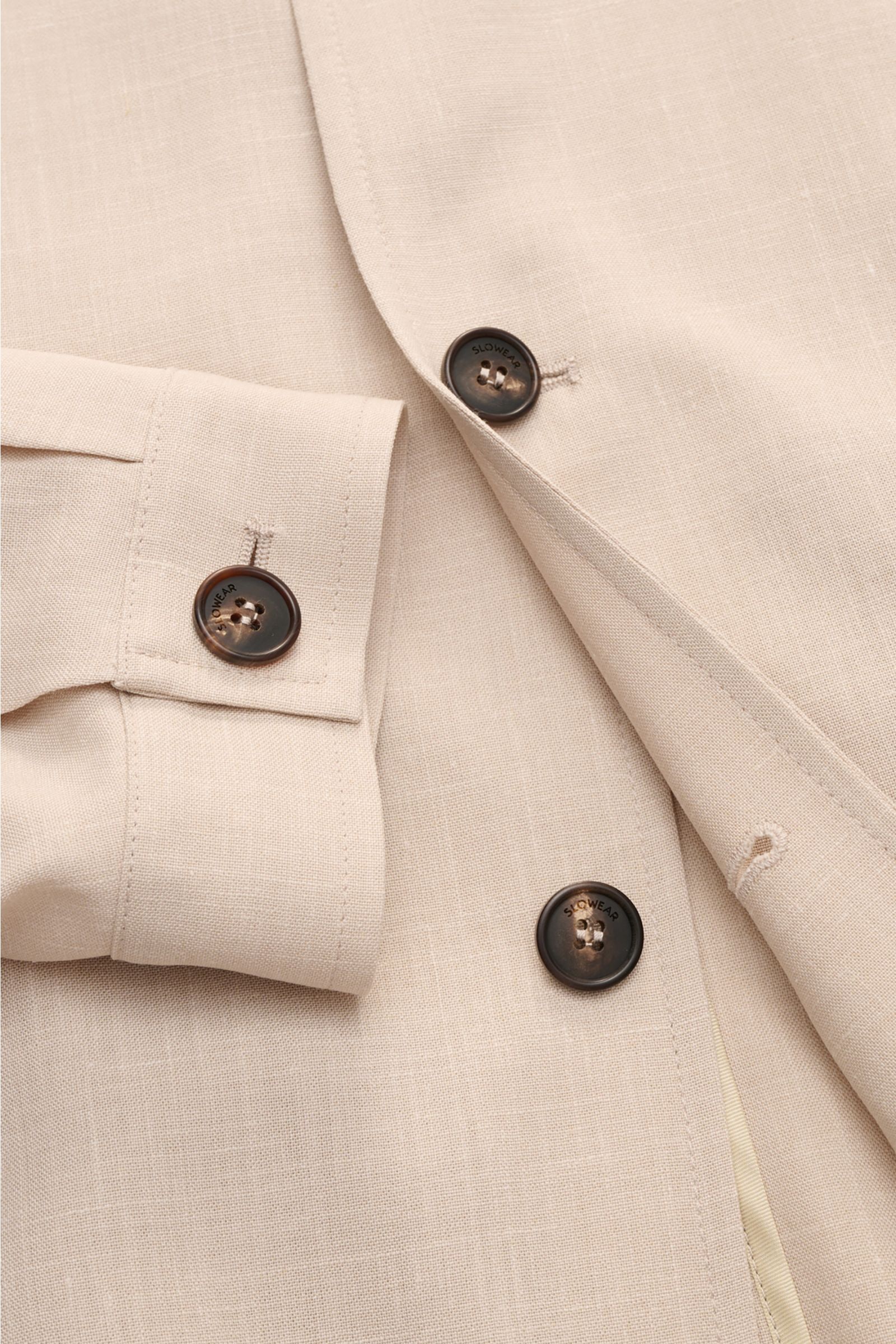 Close-up front and sleeve view of Incotex Overshirt beige mottled showing six-button placket, turn-down collar, jetted pockets, button cuffs, elasticated hem, and unconstructed design in virgin wool-silk fabric.