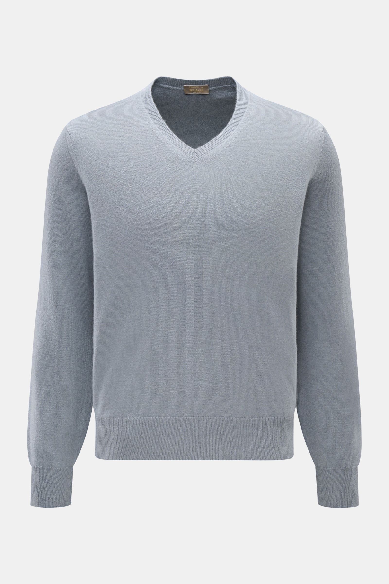 Front view of Cruciani Cashmere V-neck jumper smoky blue, pure cashmere, smooth touch, fine knit, slim fit with ribbed bands.

This V-neck jumper in pure cashmere by CRUCIANI is the epitome of understatement and style. Its smooth feel and fine knit giv