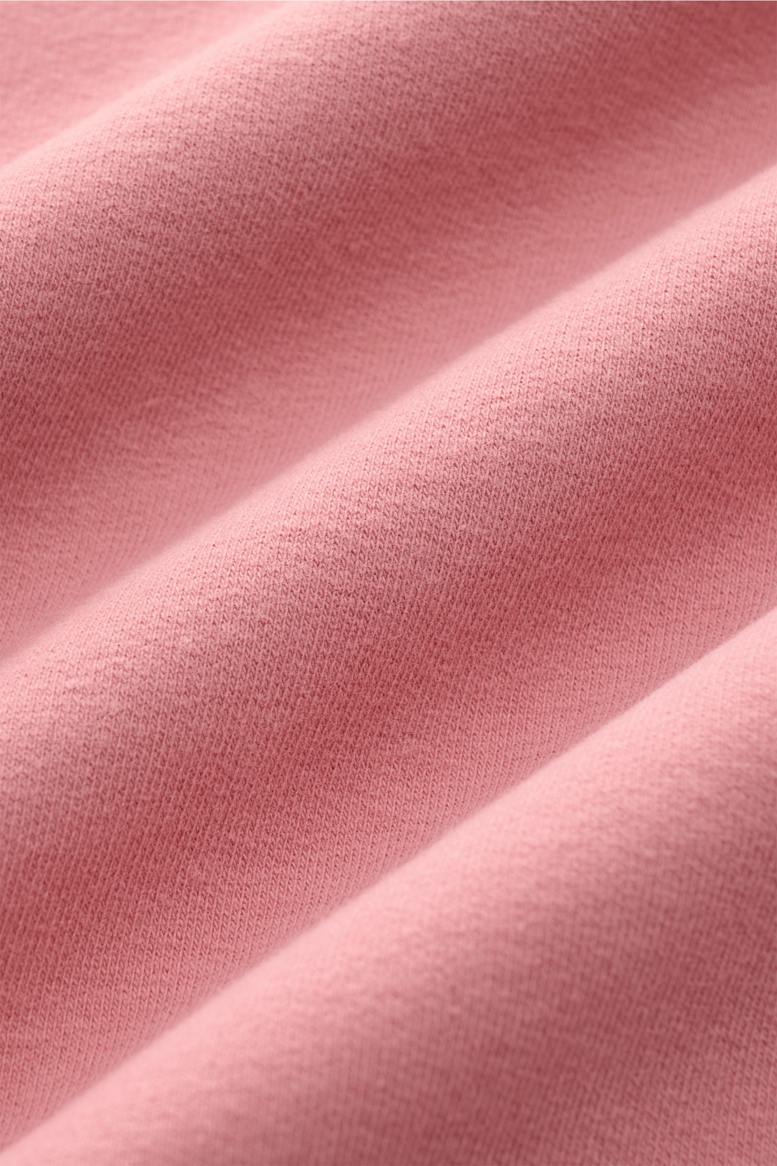 Close-up front view of the soft, stretchy cotton fabric of the 04651/ A trip in a bag Hooded jumper 'IF Hoodie' antique pink, showing brushed jersey texture.