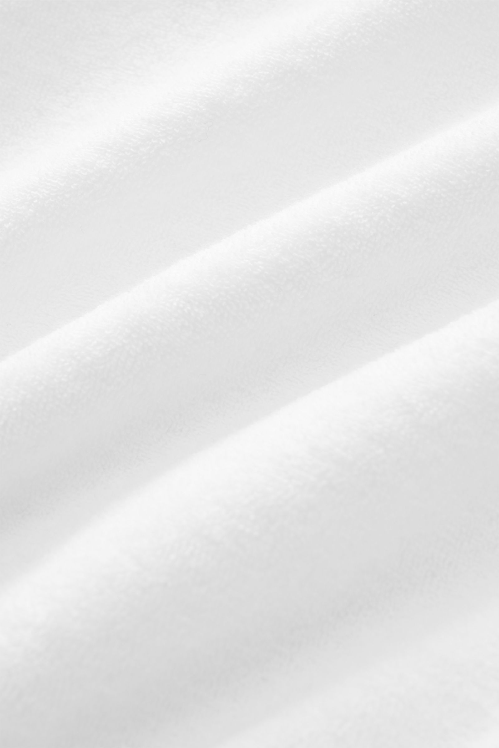 Close-up of 04651/ A Trip in a Bag Hooded jumper 'Beach Hoodie' white, soft cotton terry fabric, ideal for beach walks.