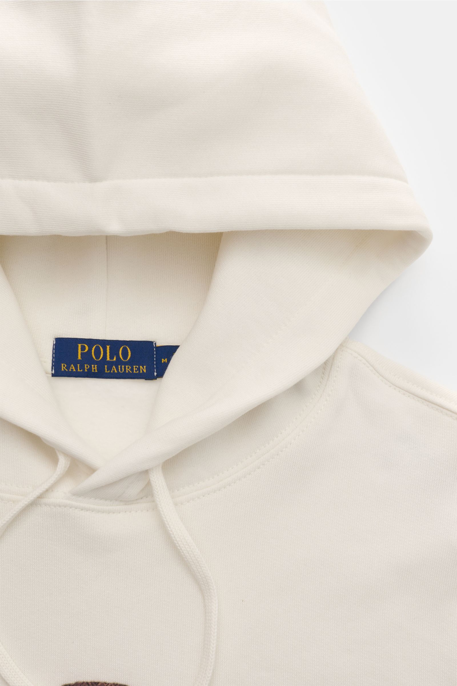 Nahaufnahme des Polo Ralph Lauren Kapuzenpullover offwhite mit Kapuze, Tunnelzug und Polo-Bear-Print, weicher Baumwoll-Mix, Regular Fit.