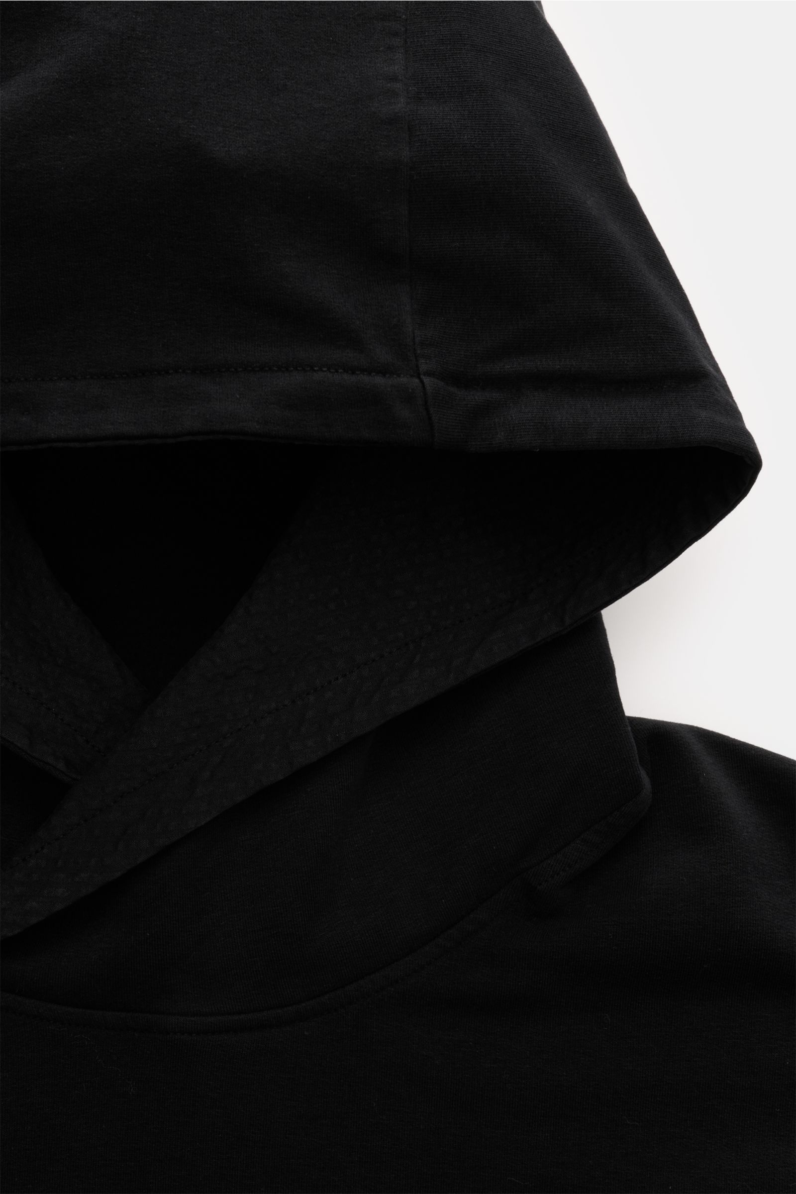 Close-up front view of the hood on the 04651/ A trip in a bag Hooded jumper 'IF Hoodie' black, made of soft, stretchy brushed cotton jersey.