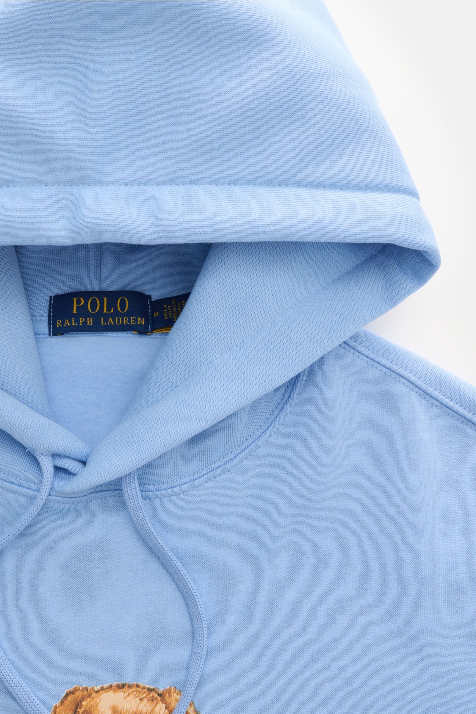 Nahaufnahme des hellblauen Polo Ralph Lauren Kapuzenpullover mit Polo-Bear-Print, Kapuze, Tunnelzug und weichem Baumwoll-Mix aus Frontperspektive.