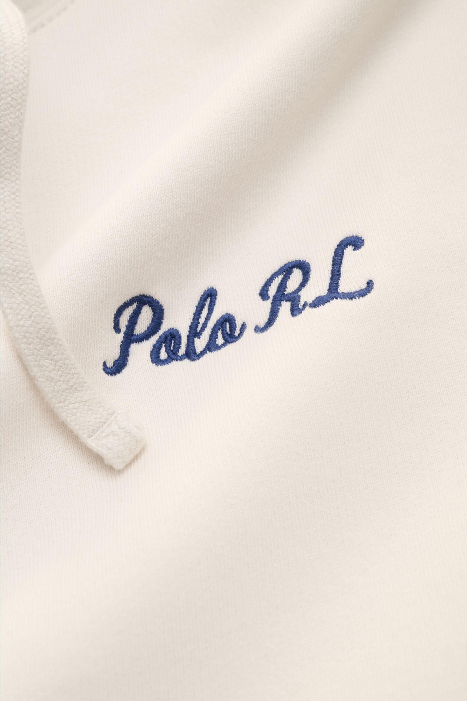 Close-up front view of Polo Ralph Lauren Hooded jumper white showing blue embroidered 'Polo RL' signature on soft white fabric with drawstring.

Description: Iconic signature style by POLO RALPH LAUREN: This hooded jumper with a soft fleece lining comb