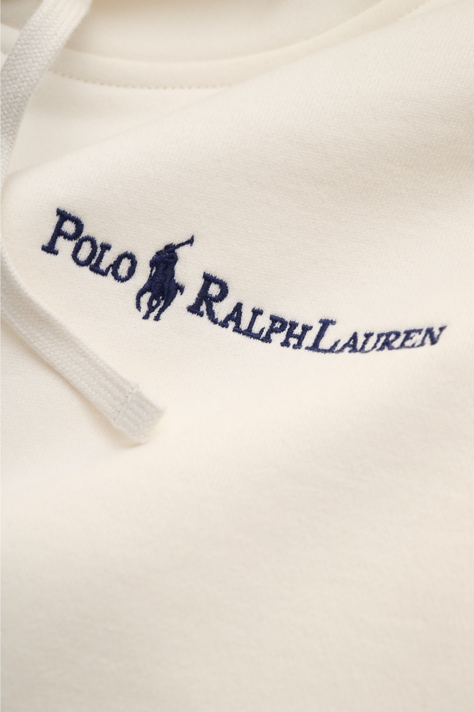Alt tag (125 characters max): Close-up front view of Polo Ralph Lauren Hooded jumper white with navy logo stitching and drawstring on soft cotton fabric.

Description:  
Sporty and relaxed: This classic hooded jumper by POLO RALPH LAUREN in soft cotton