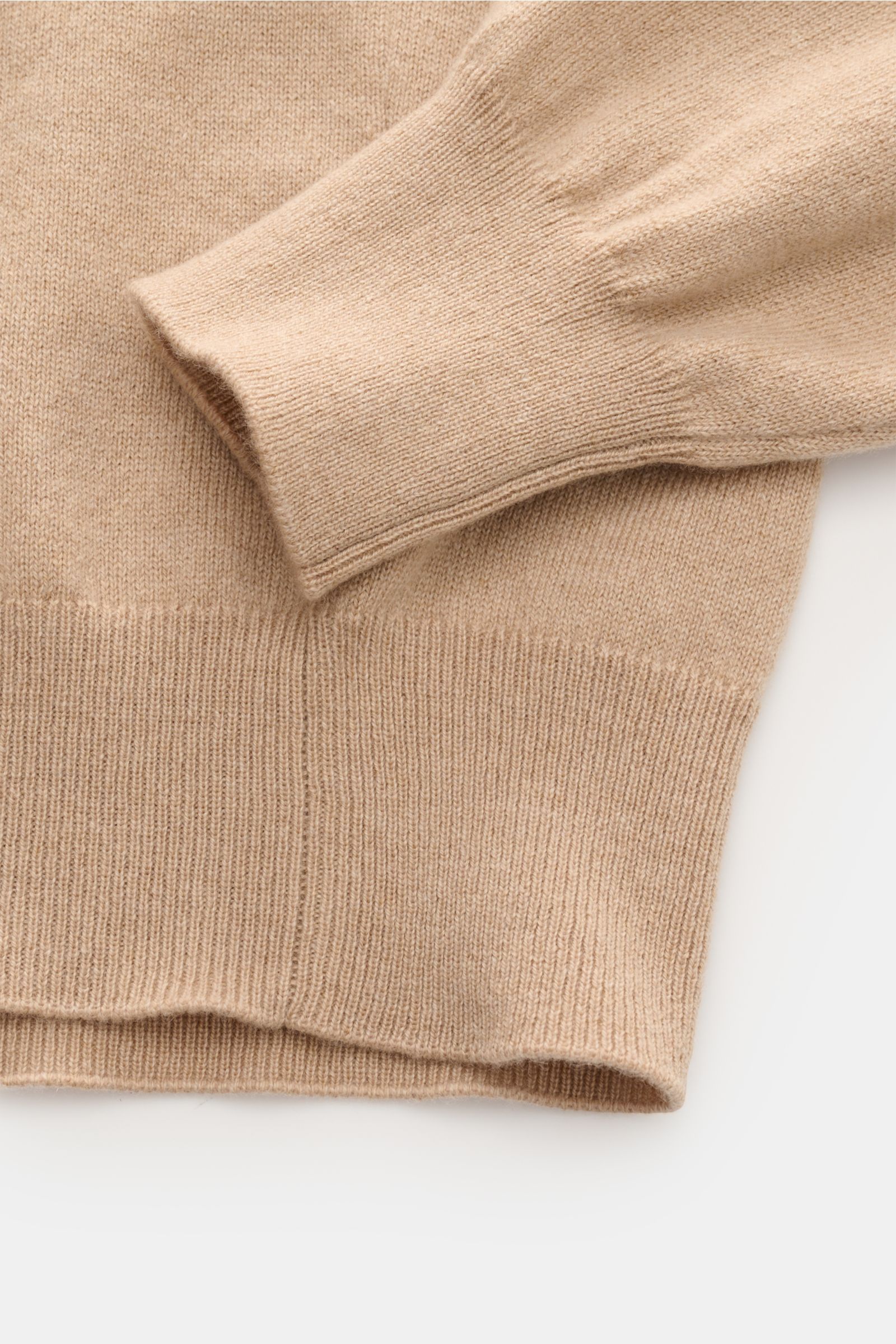 Close-up top view of the beige Cruciani Cashmere turtleneck jumper showing fine knit, slim fit, and elasticated rib knit bands on sleeve and hem.

Description: CRUCIANI brings us a classic basic for the colder months with this slim cut turtleneck jumpe