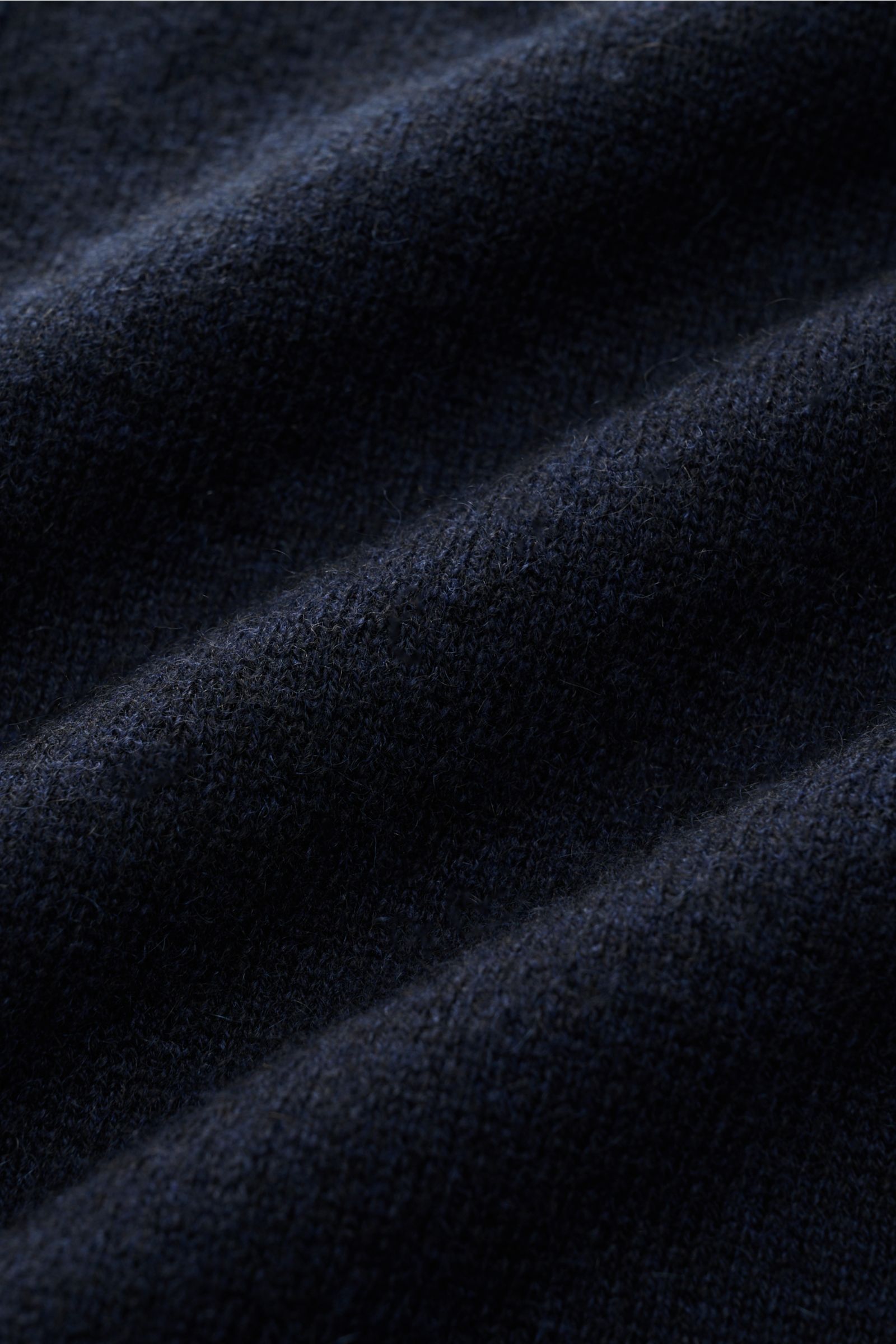 Close-up image of the navy fabric texture of the FTC Cashmere half-zip jumper navy, photographed from a top-down perspective. Luxurious comfort: This soft half-zip jumper by FTC has a timeless design that makes it a versatile basic for the colder months. 