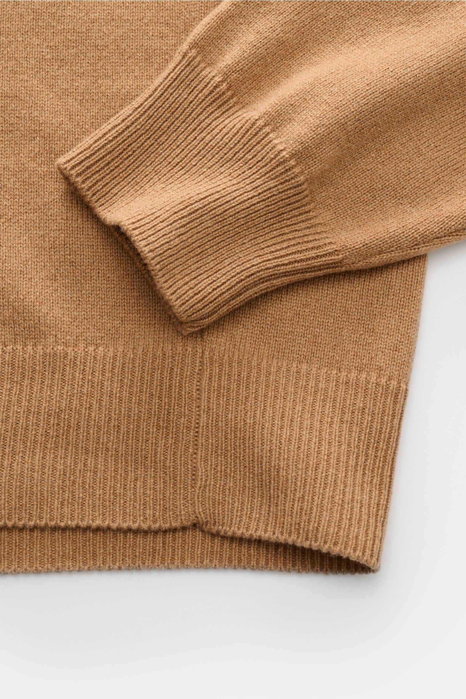 Close-up front view of Moorer Turtleneck jumper 'Todi' camel, showing fine knit fabric, slim fit, soft cashmere and silk blend, close-fitting turtleneck, and flexible ribbed bands on cuff and hem.