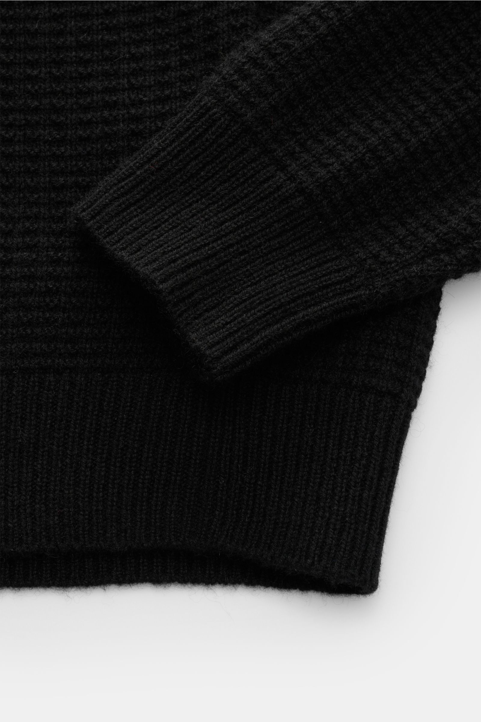 Close-up front view of von Braun Cashmere mock neck jumper black showing fine textured knit, ribbed mock neck, and cuffs.

Get ready for the colder months with VON BRAUN: This jumper with mock neck in pure, Mongolian cashmere in an elegant textured kni
