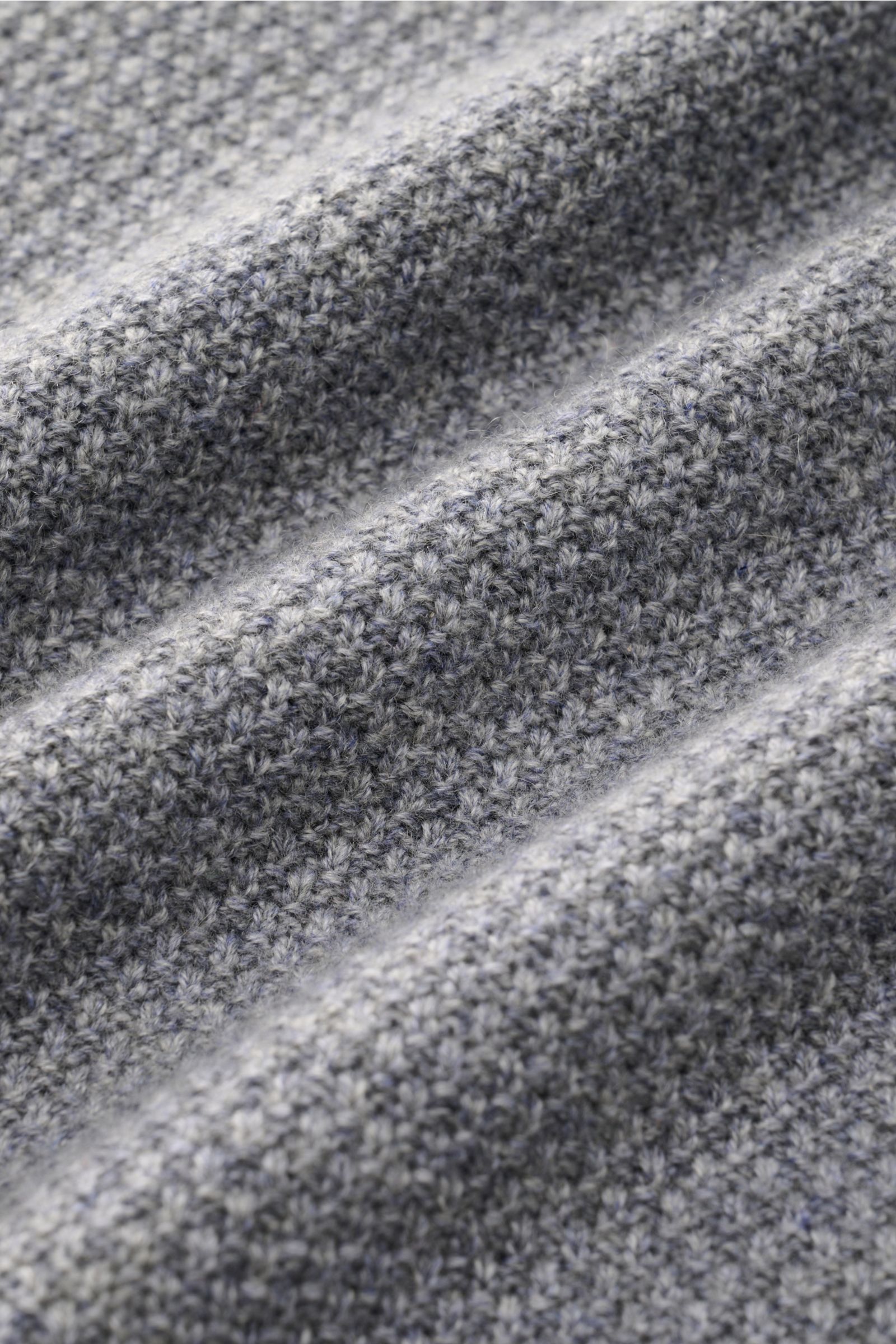 Alt tag (125 characters max):
Close-up front view of von Braun Cashmere turtleneck jumper grey mottled showing fine textured, soft Mongolian cashmere knit.

Additional description:
Get ready for the colder months with VON BRAUN: This turtleneck jumper 