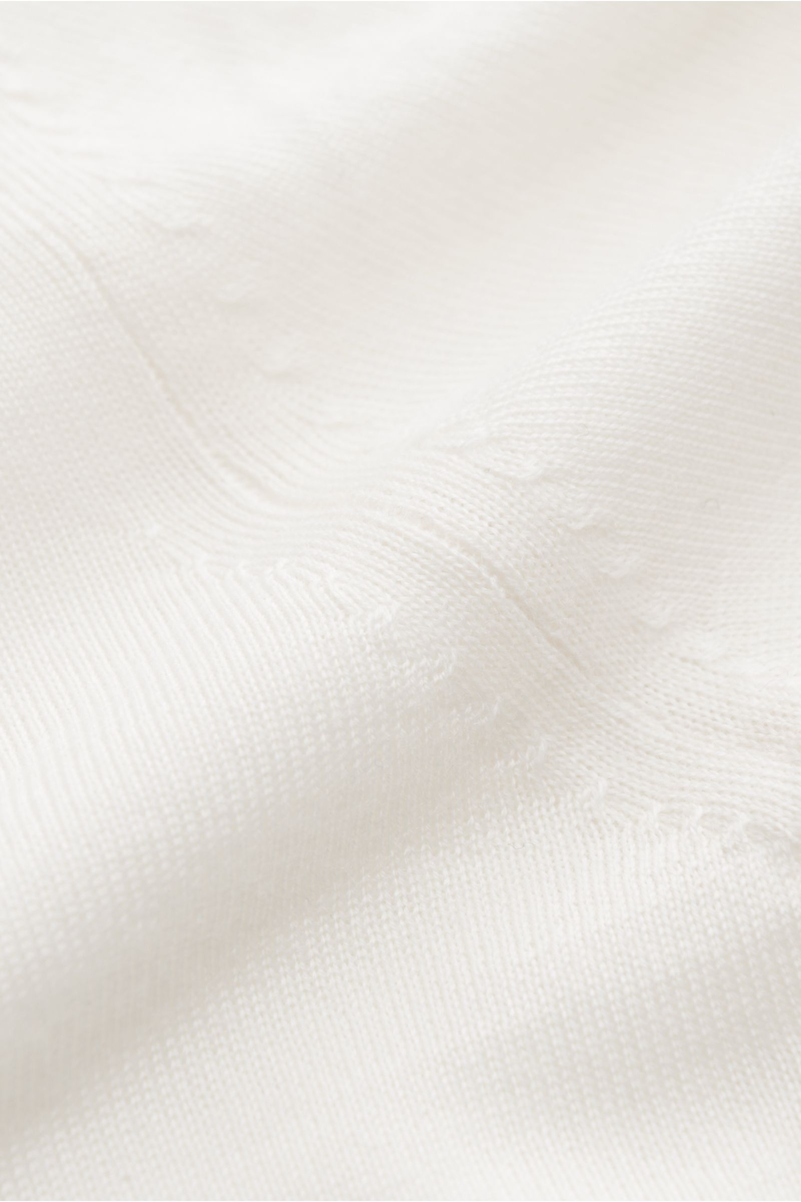 von Braun Merino Rollkragenpullover creme aus feiner Merinowolle, Slim Fit mit anliegendem Rollkragen und flexiblen Rippbündchen, Detailfoto des Strickbilds aus Nahaufnahme