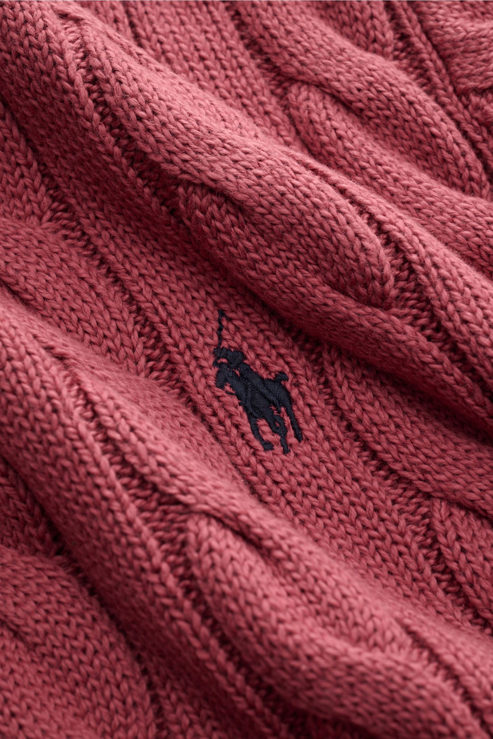 Close-up view of the Polo Ralph Lauren Crew neck jumper bright red, showcasing the textured cable knit and classic navy polo player stitching on pure cotton fabric.

A classic from POLO RALPH LAUREN: This pure cotton jumper is decorated with textured c