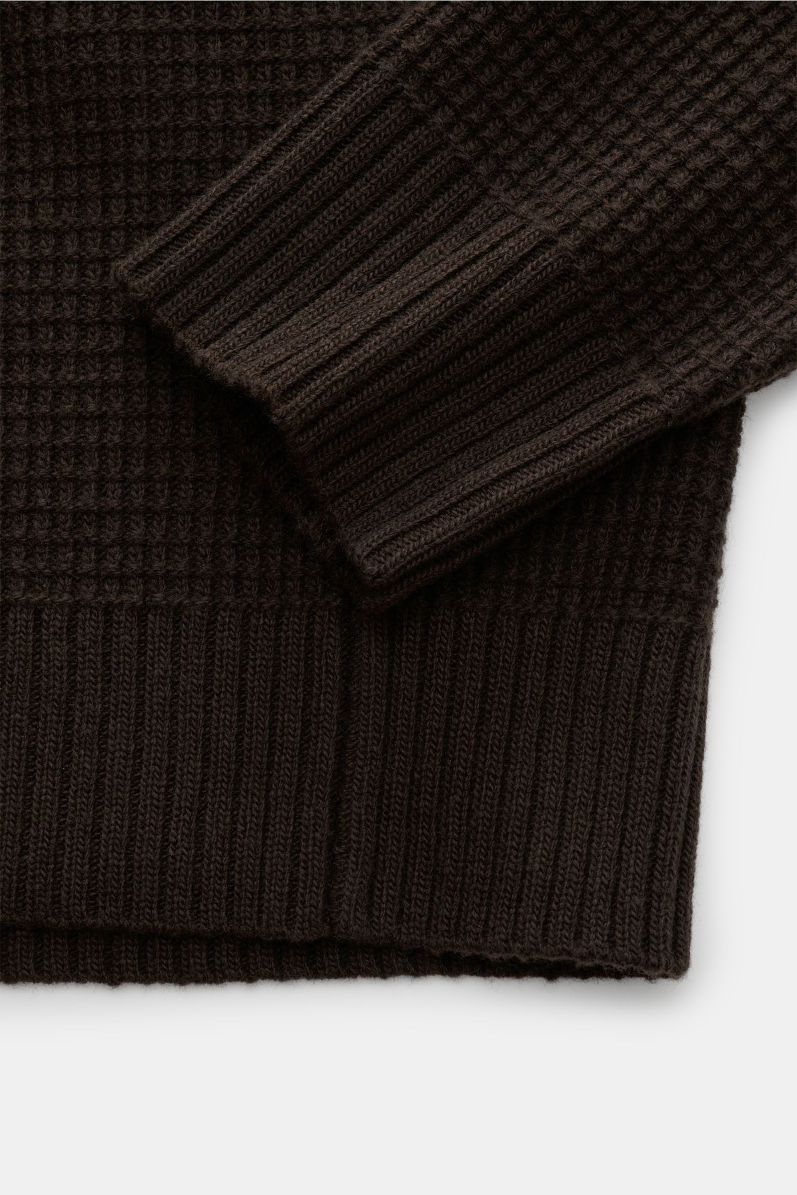 Close-up image of the Stone Island Crew neck jumper 'Ghost' dark brown showing textured knit, ribbed cuffs, and hem from above.

Description:  
A versatile winter essential: This crew neck jumper from the 'Ghost' capsule collection by STONE ISLAND is a