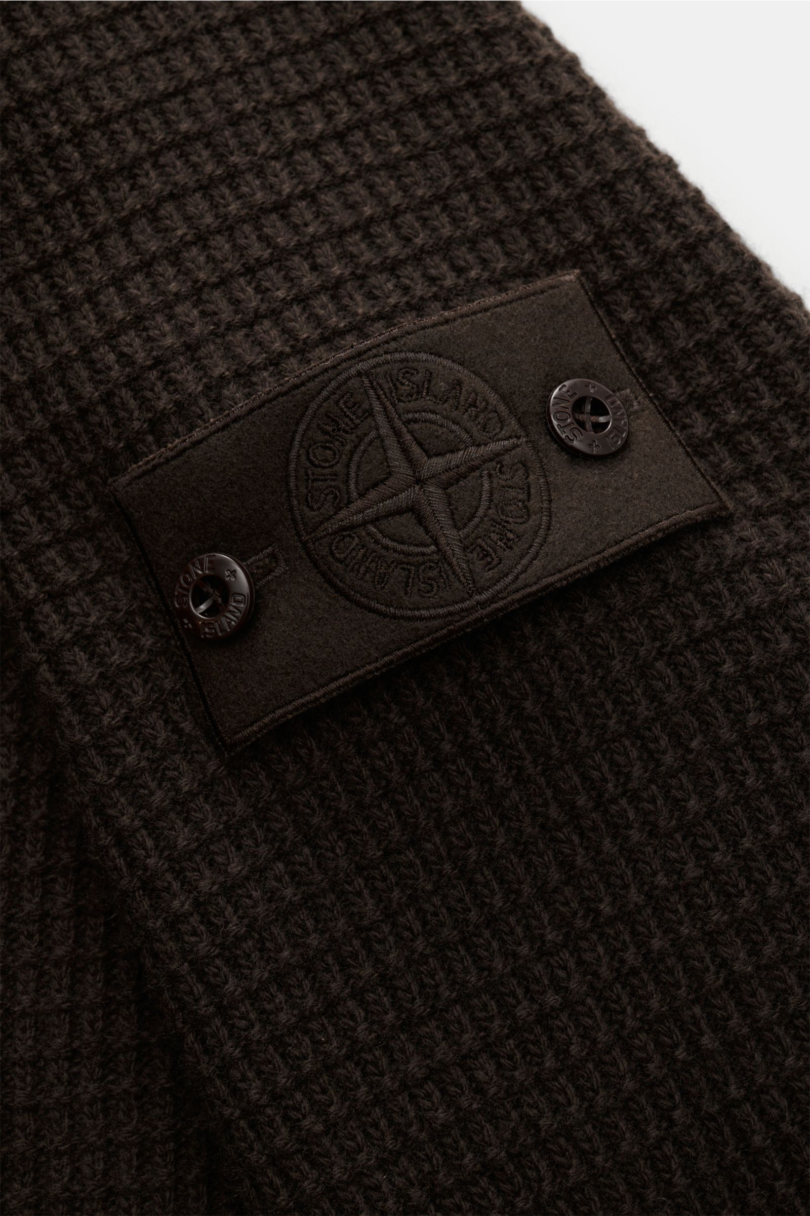 Stone Island Crew neck jumper 'Ghost' dark brown shown from a close-up angle highlighting the textured knit and compass badge on the sleeve. 

A versatile winter essential: This crew neck jumper from the 'Ghost' capsule collection by STONE ISLAND is a 