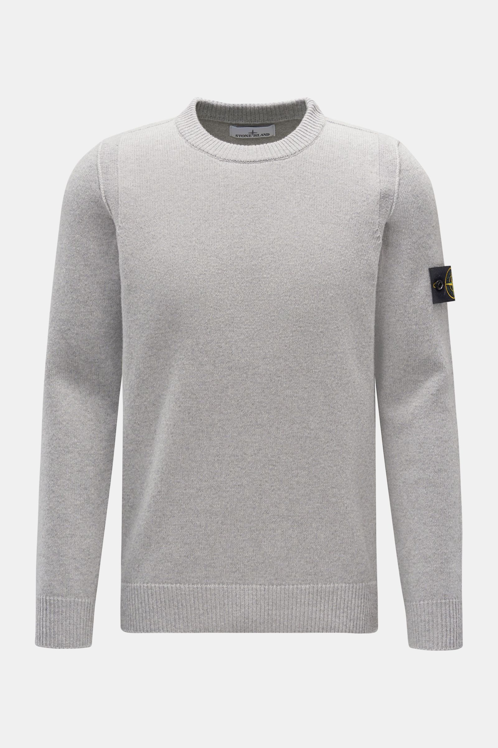 Stone Island Crew neck jumper 'Lambswool' light grey shown from the front in a slim fit with medium-fine knit, elasticated hem, and signature compass badge on the sleeve. A stylish essential for the colder months: Enjoy the colder seasons in style, with t