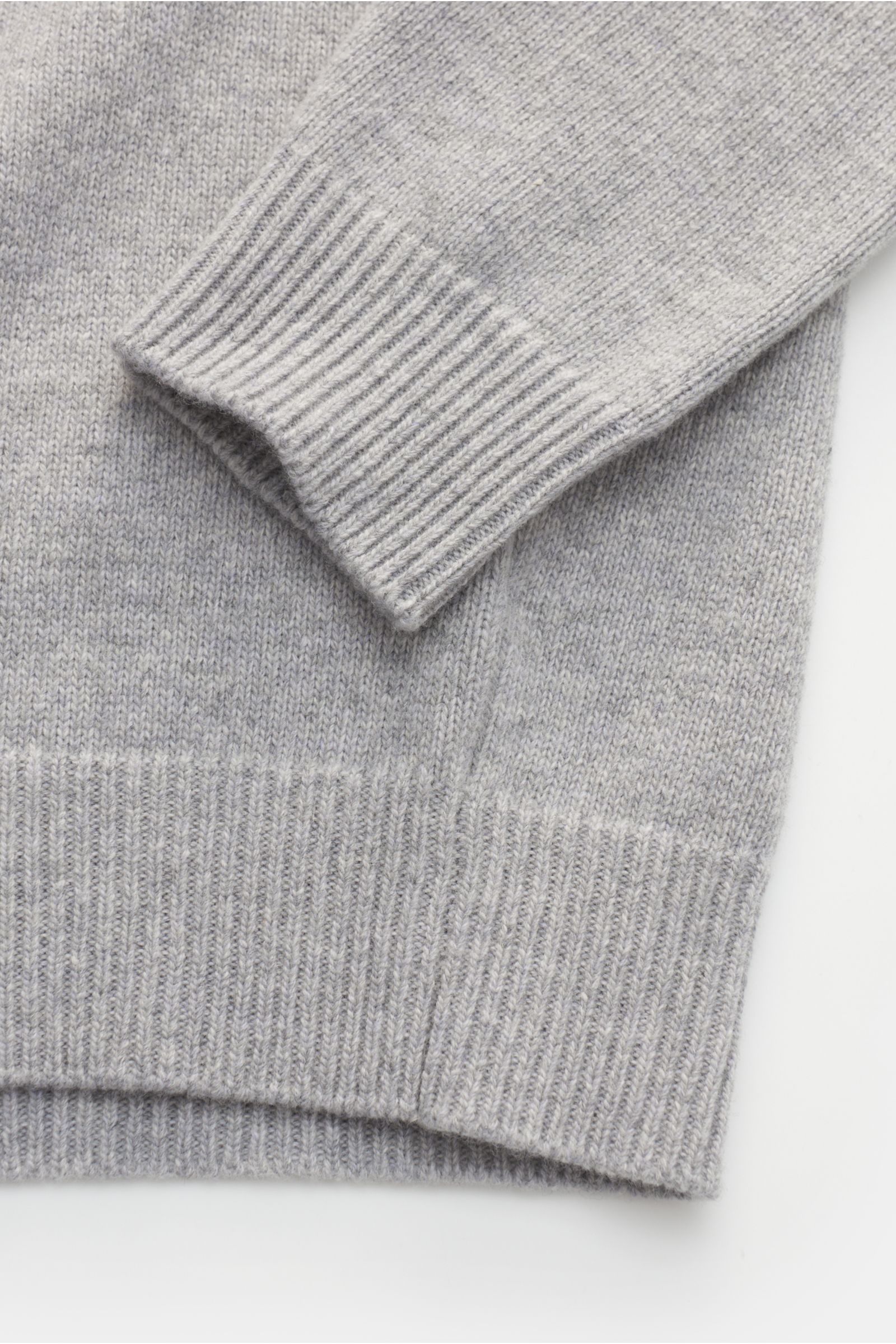 Stone Island Crew neck jumper 'Lambswool' light grey shown in close-up from above, detailing ribbed cuffs and hem, soft wool knit.

A stylish essential for the colder months: Enjoy the colder seasons in style, with this casual jumper by STONE ISLAND fe