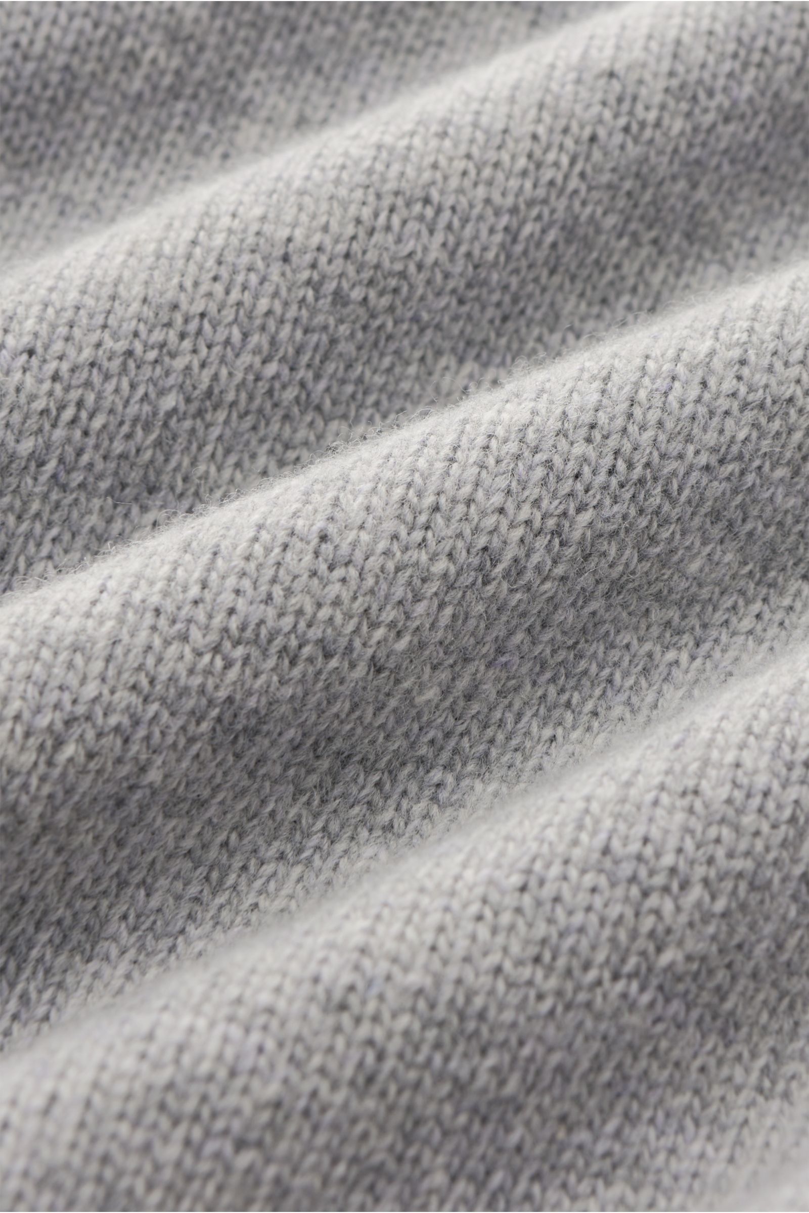 Close-up front view of Stone Island Crew neck jumper 'Lambswool' light grey showing detailed medium-fine knit wool and microfiber fabric texture.

A stylish essential for the colder months: Enjoy the colder seasons in style, with this casual jumper by 