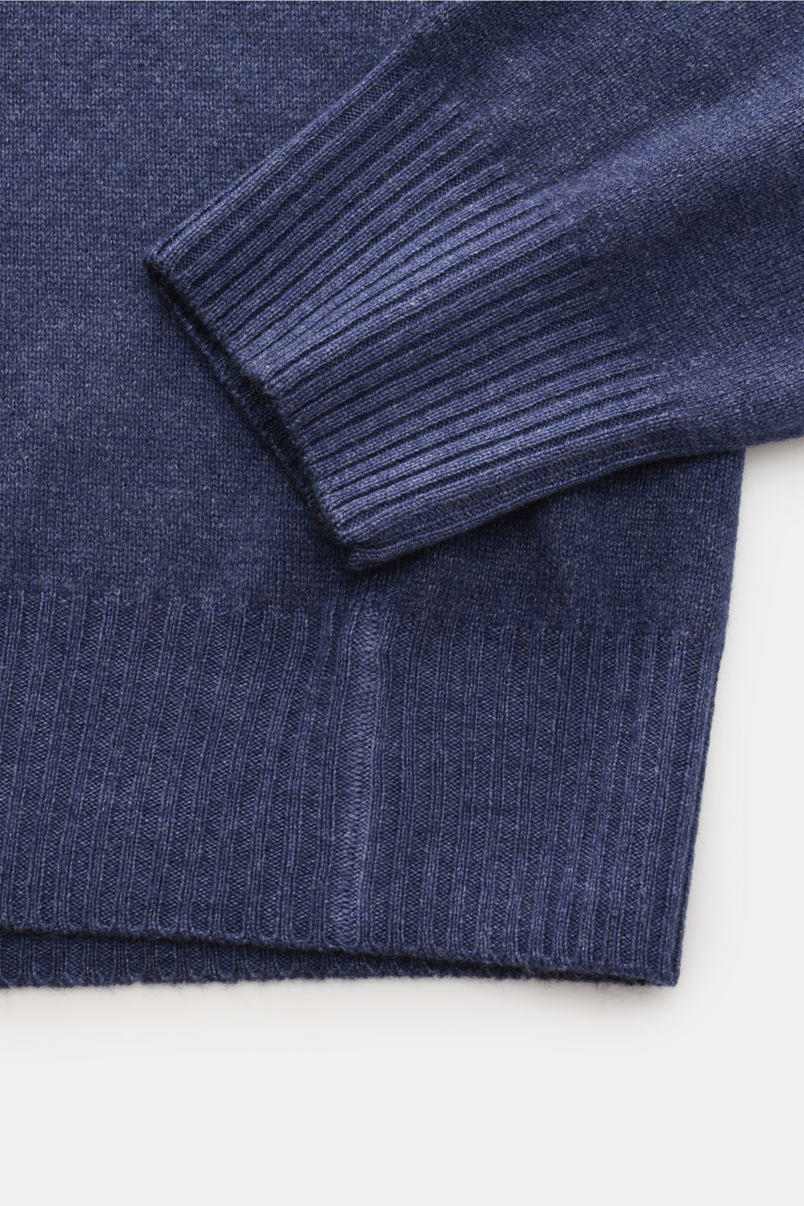 Close-up top-down view of the dark blue melange BRAUN Hamburg Crew neck jumper showing ribbed cuffs and hem. Winter all-rounder: With its warm, comfortable material, this crew neck jumper from BRAUN Hamburg is a timeless essential for the colder months. V