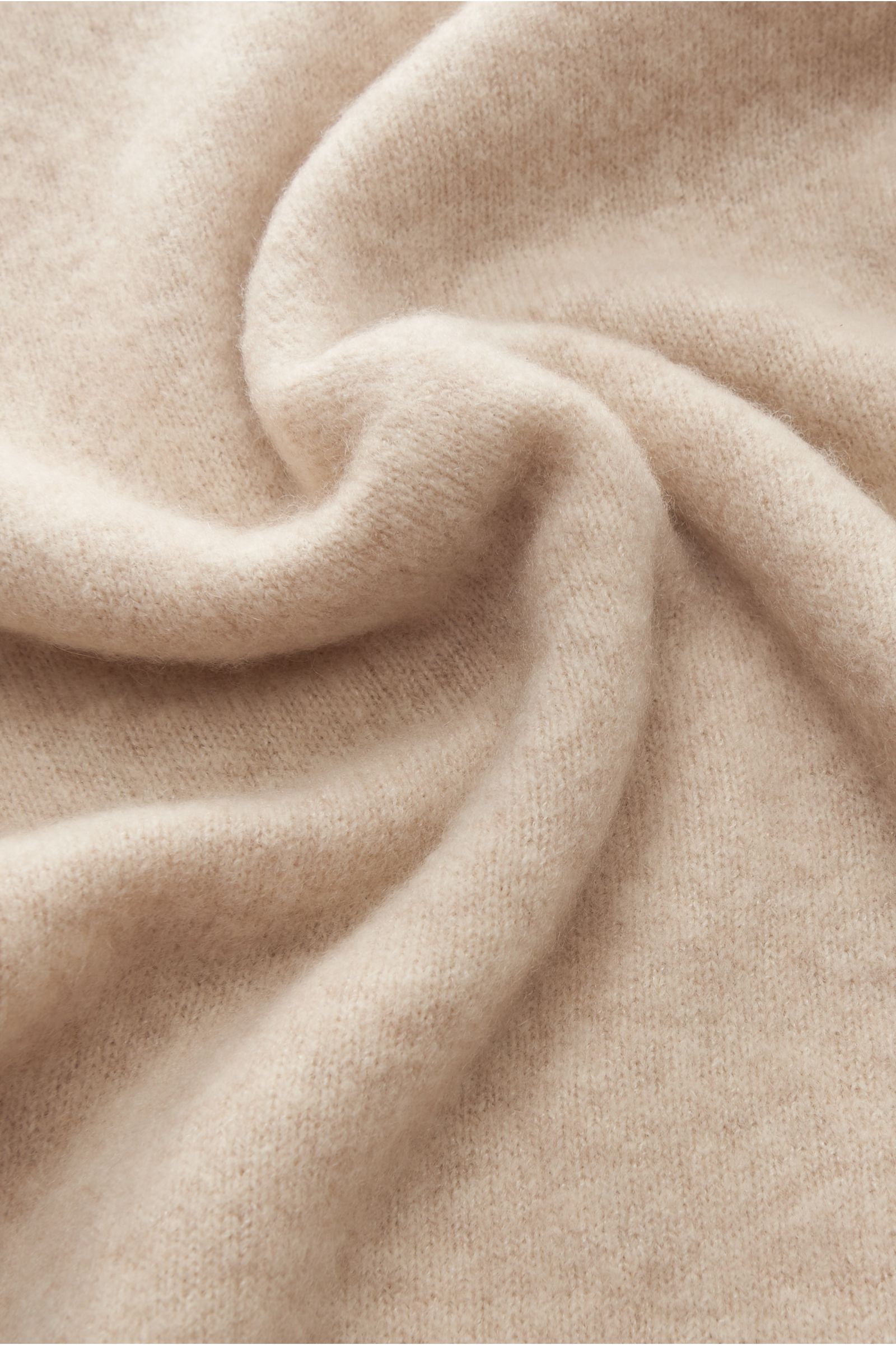 Close-up top-down view of the soft, fine knit fabric of the Piacenza 1733 Crew neck jumper sand, made from a blend of cashmere, silk, and microfibre.  

Description:  
What is probably this season’s softest crew neck jumper comes from Italian spinning 