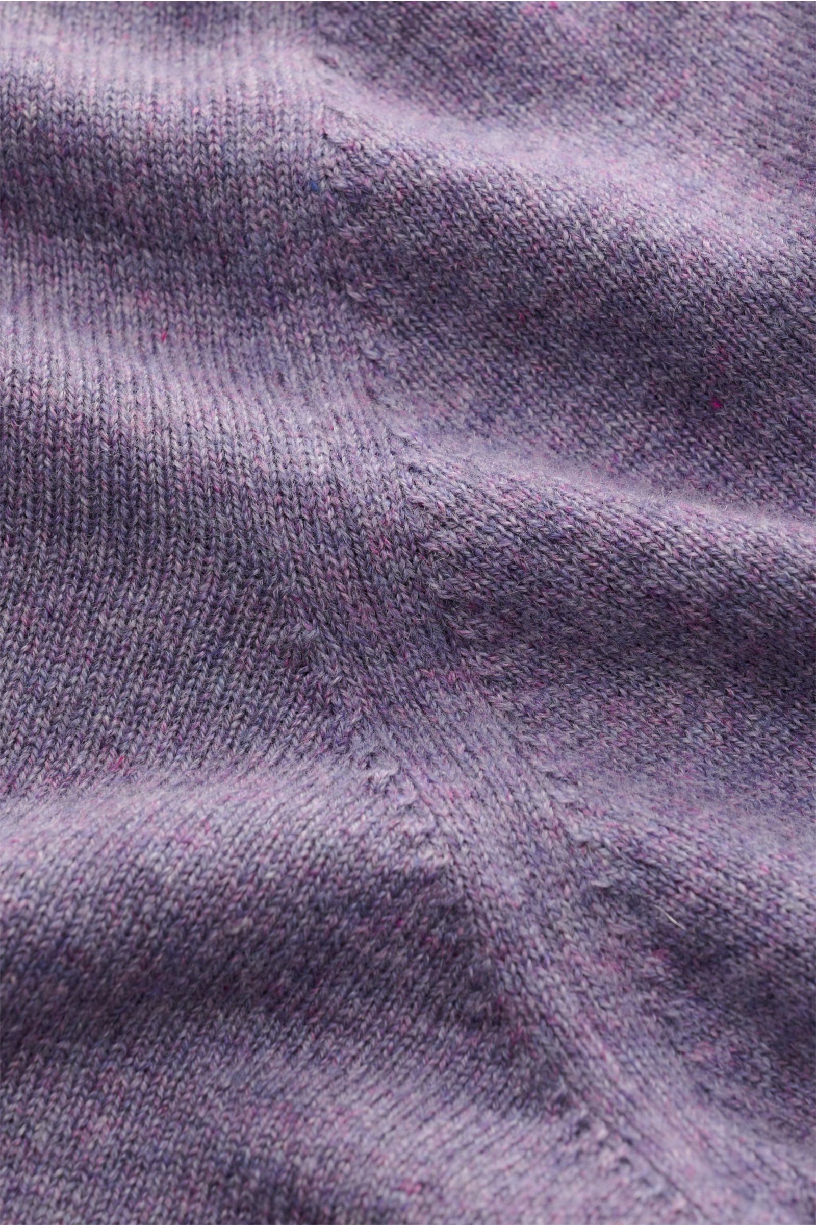 Close-up view of the finely knit, purple mottled fabric of the Brunello Cucinelli Cashmere crew neck jumper, showing soft texture and subtle stitch details.

This luxurious cashmere jumper with crew neck by BRUNELLO CUCINELLI is a versatile essential t