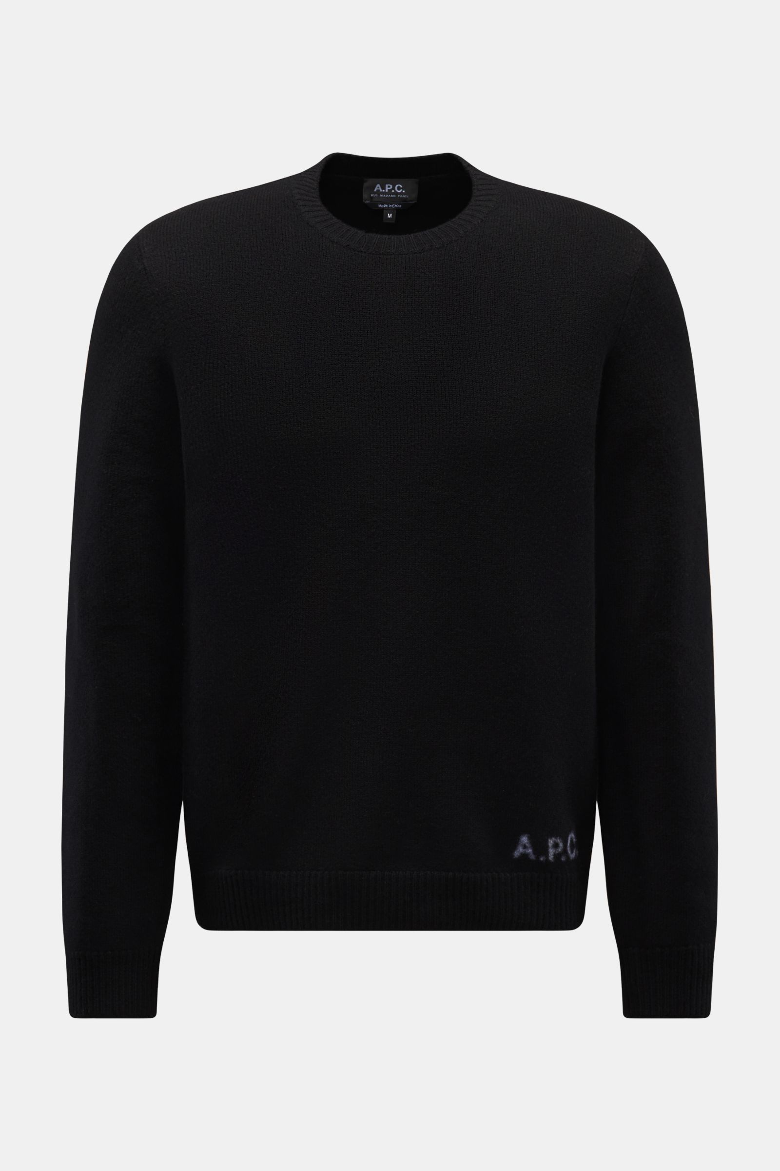 Front view of A.P.C. Rundhalspullover 'Edward' schwarz, a black slim fit sweater made of pure wool, featuring a soft feel, medium-fine knit texture, flexible ribbed cuffs, and a discreet logo on the front.