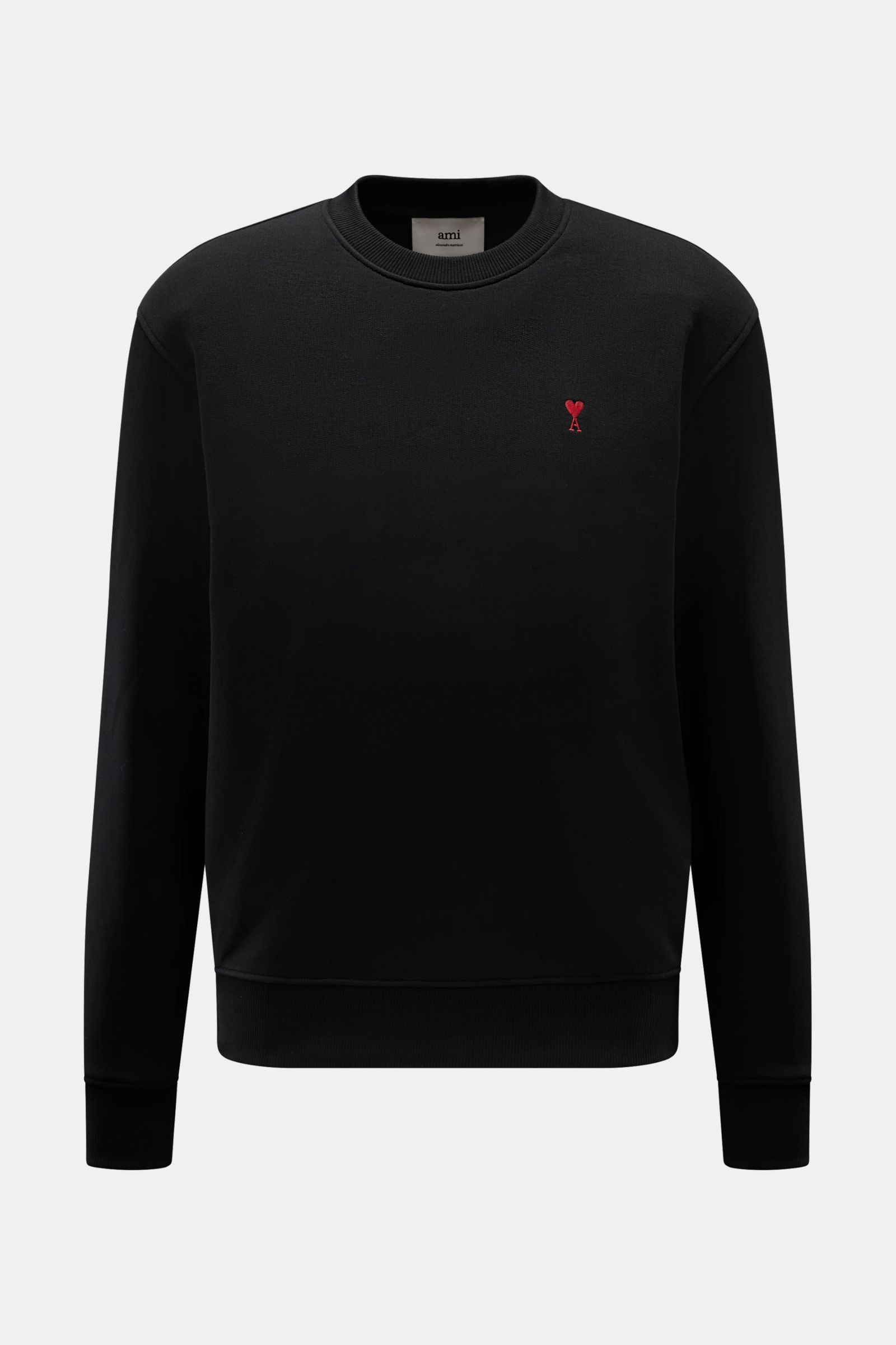 Front view of Ami Paris Rundhals-Sweatshirt schwarz, a black unisex sweatshirt made of lightly stretchy organic cotton with a round neckline, oversized fit, ribbed cuffs, and the brand's signature red heart stitching on the chest and AMI stitching on the 