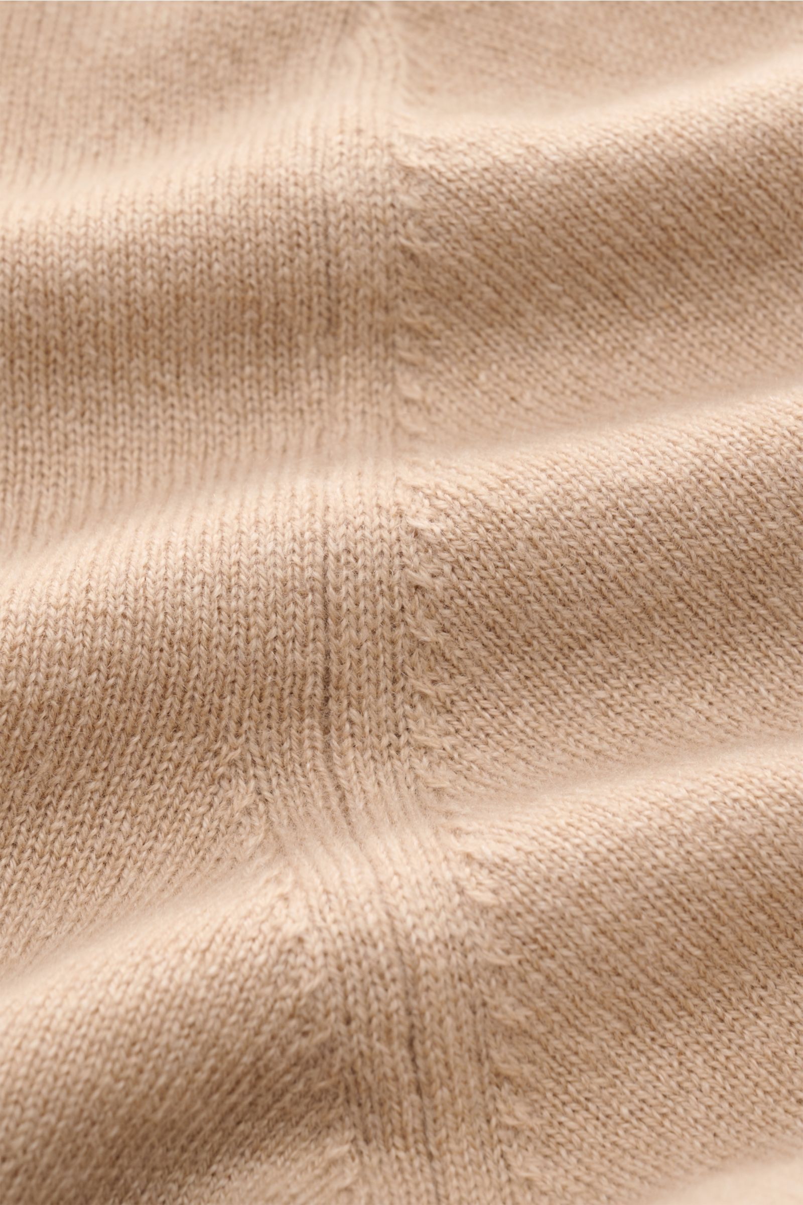 Close-up top-down view of beige Cruciani Cashmere crew neck jumper, showing fine knit texture and soft cashmere yarn.

Description: CRUCIANI has used the finest soft cashmere yarn to create a classic crew neck jumper that is warm and versatile.
