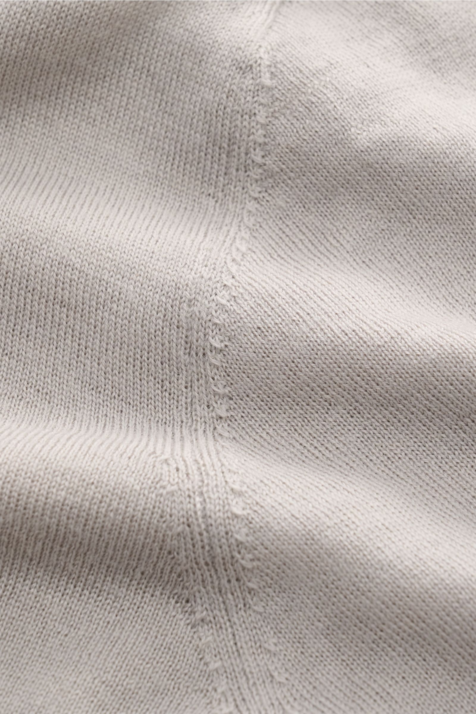 Close-up view of the Kiefermann Merino fine knit jumper 'Benjamin' light grey, showcasing pure merino wool, super soft touch, very fine knit, slim fit, crew neck, and open, rolled hems.