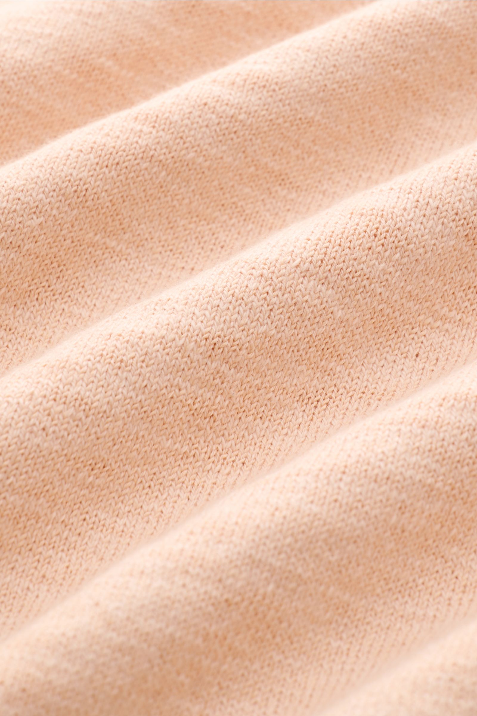 Close-up front view of the Stone Island Crew neck jumper apricot showing fine knit texture with a soft feel and rolled edges.

STONE ISLAND has transformed this crew neck jumper into a sophisticated basic with fine details like the rolled hem and strat