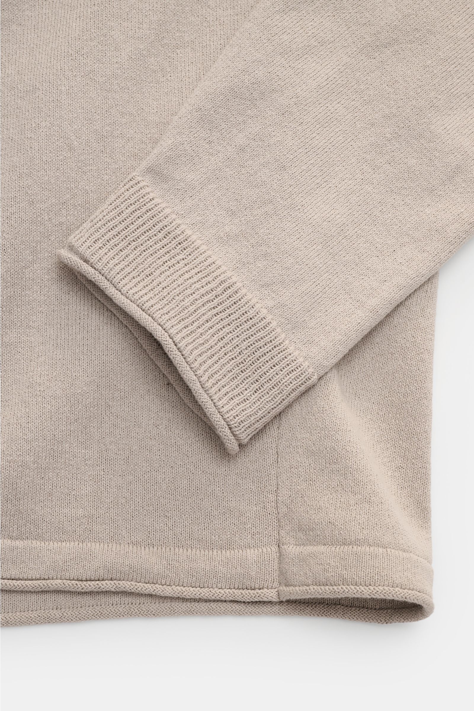 Close-up, top-down view of Stone Island Crew neck jumper light grey showing fine knit fabric, rolled edges, and cuff details.

Description: STONE ISLAND has transformed this crew neck jumper into a sophisticated basic with fine details like the rolled 