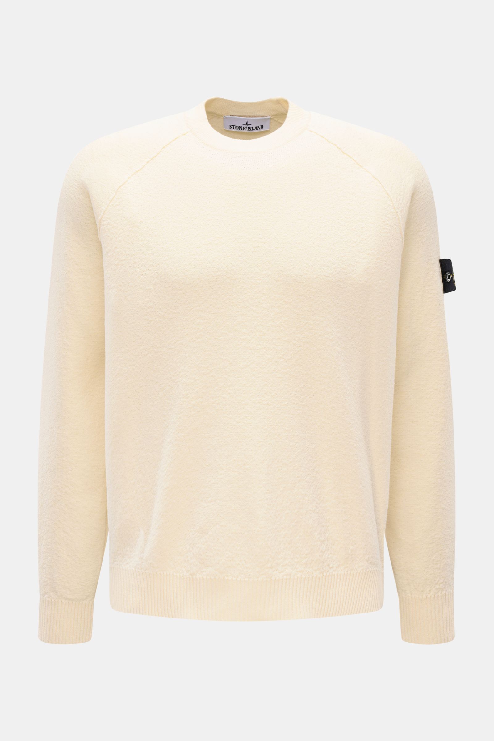 Stone Island Rundhalspullover creme, frontale Ansicht, leichter Strick aus reiner Baumwolle, Rundhals, Raglanärmel, Rippbündchen, Logo-Badge am Ärmel.