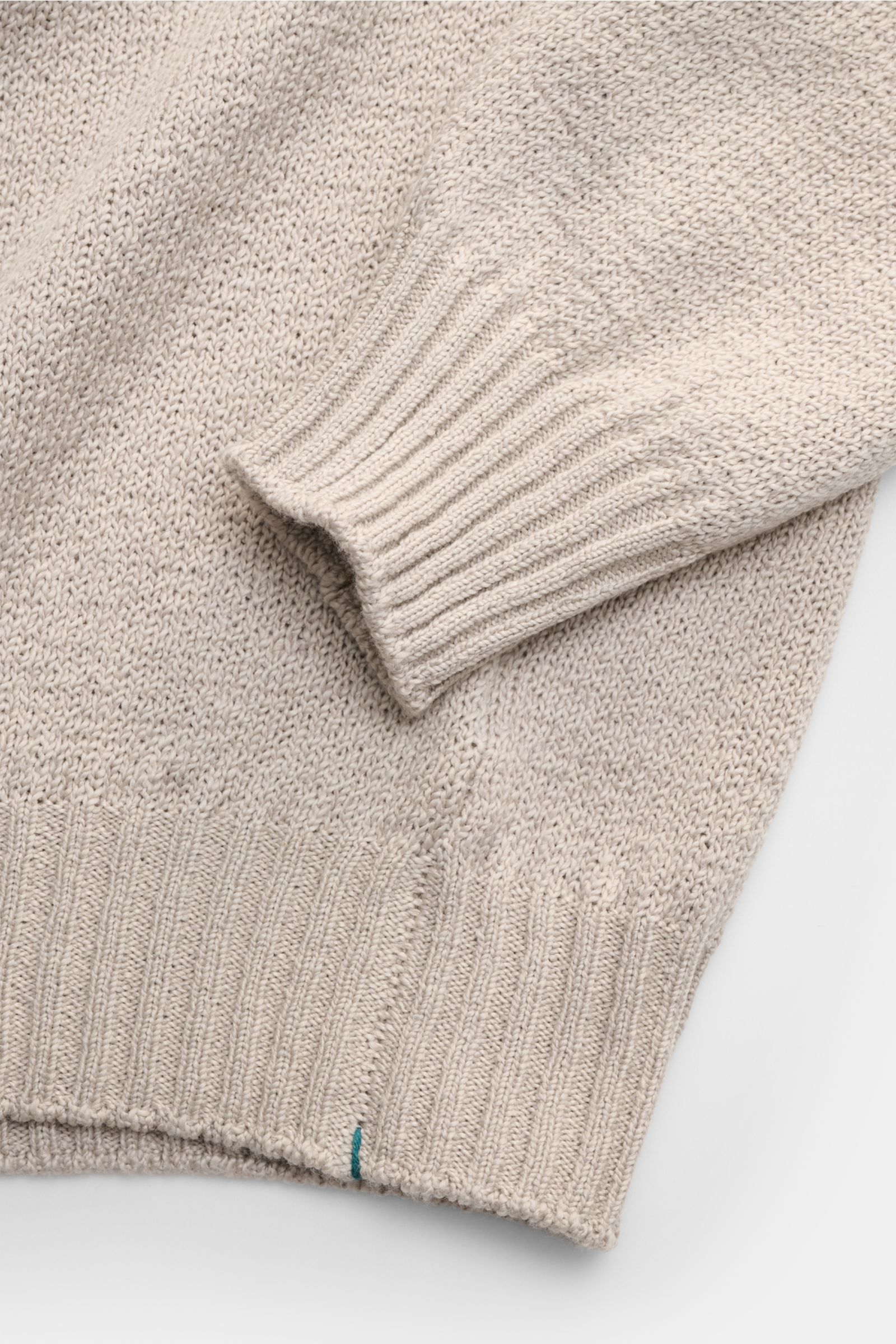 Close-up front view of Fioroni Crew neck jumper beige showing medium-fine knit, slim fit, flexible ribbed bands, and soft pure cotton fabric.
