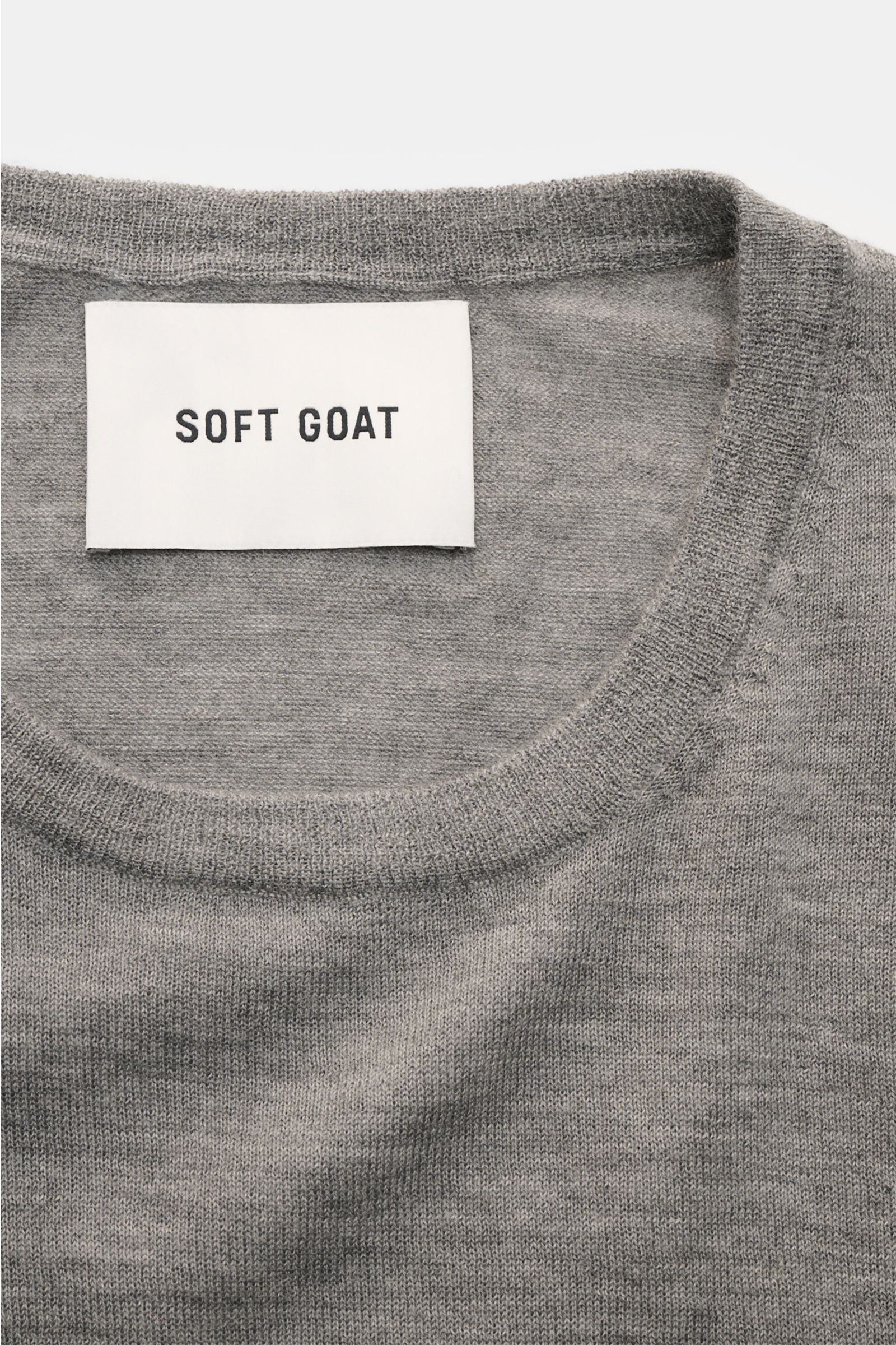 Soft Goat Cashmere crew neck jumper grey mottled shown from a close-up top front view, featuring fine knit, wide ribbed bands, and crew neck collar. Sustainably produced and certified: Young label SOFT GOAT shows how it’s done with its super lightweigh
