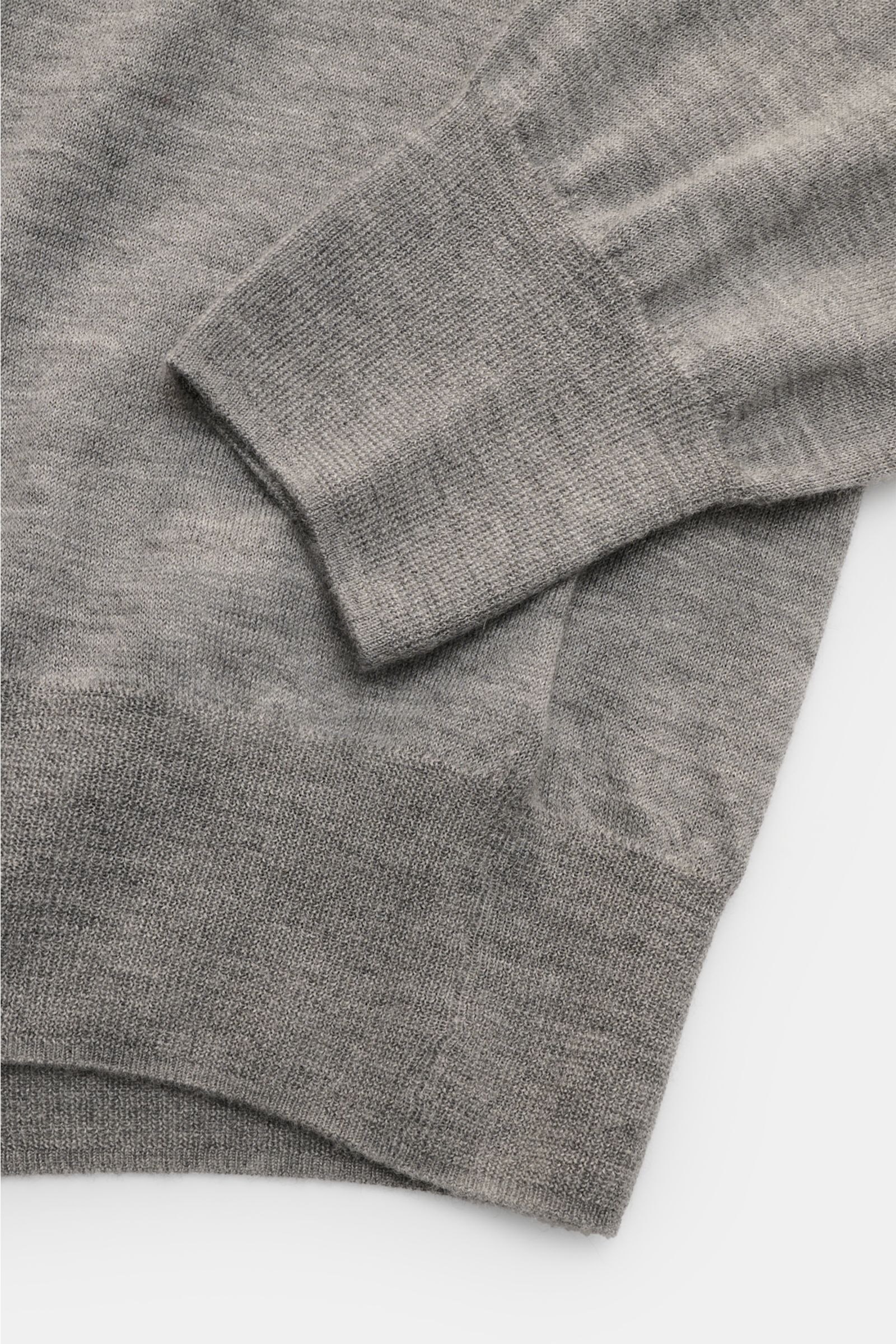 Soft Goat Cashmere crew neck jumper grey mottled shown from a close-up top view, highlighting wide ribbed bands on cuffs and hem, fine knit texture, and soft, lightweight sustainable cashmere material. Sustainably produced and certified: Young label SO
