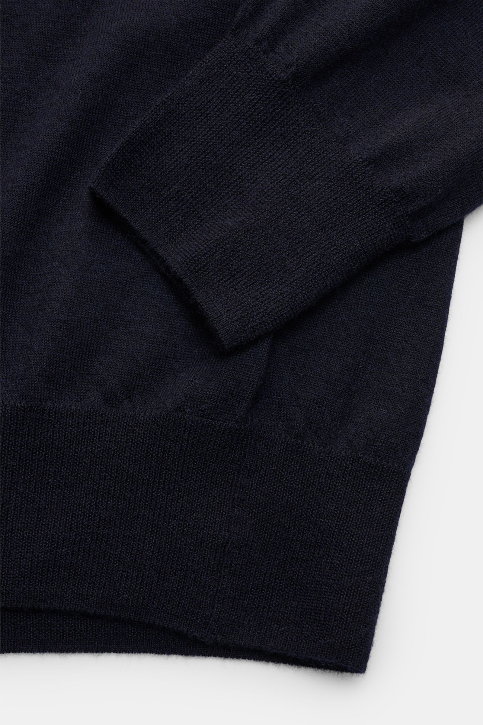 Alt tag (125 characters max):
Close-up from above of Soft Goat Cashmere crew neck jumper navy showing fine knit, ribbed cuffs, and hem detail.

Additional description:
Sustainably produced and certified: Young label SOFT GOAT shows how it’s done with i