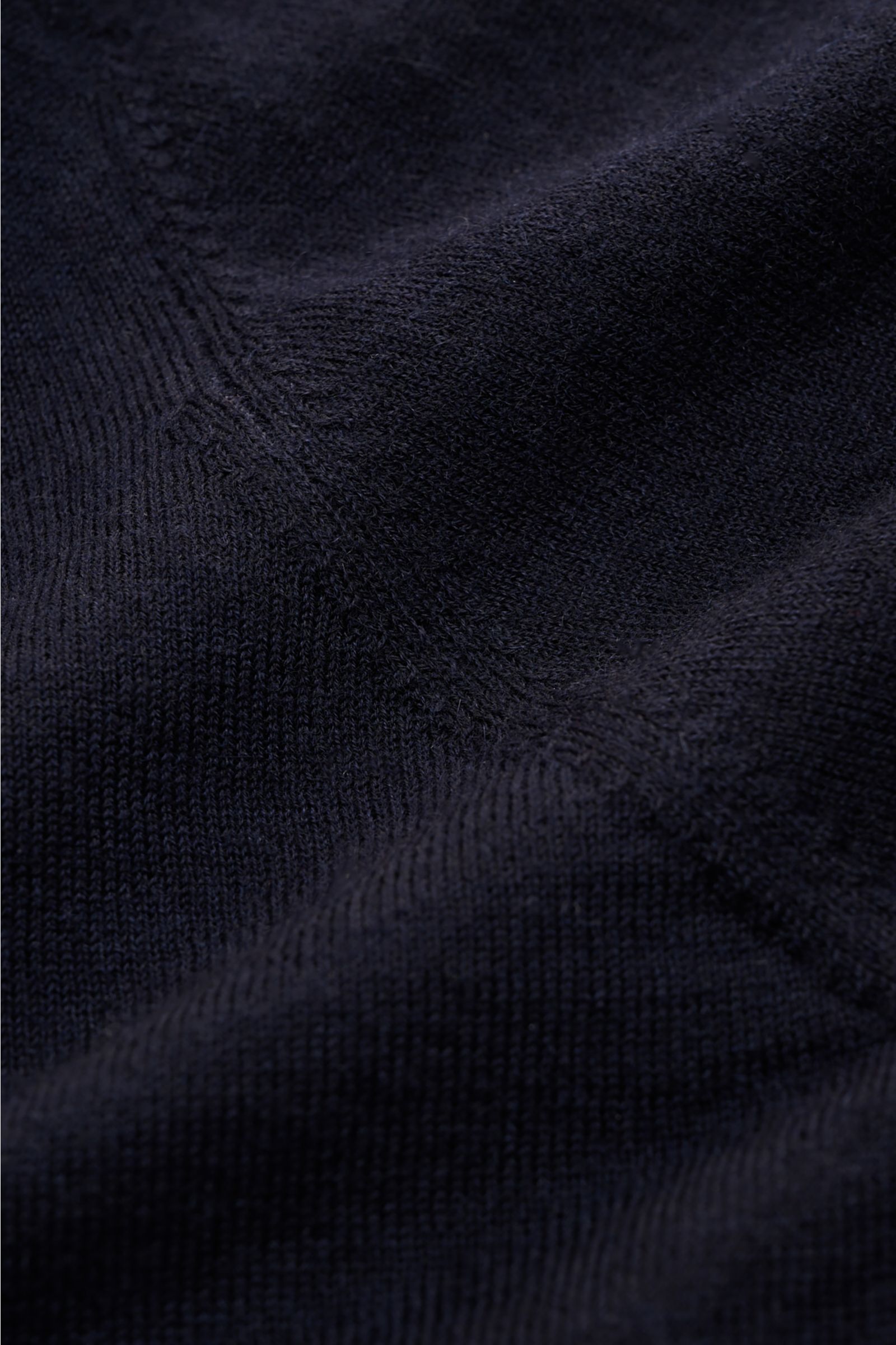 Close-up front view of Soft Goat Cashmere crew neck jumper navy showing fine knit, wide ribbed bands, and soft texture of sustainable cashmere.

Sustainably produced and certified: Young label SOFT GOAT shows how it’s done with its super lightweight ca