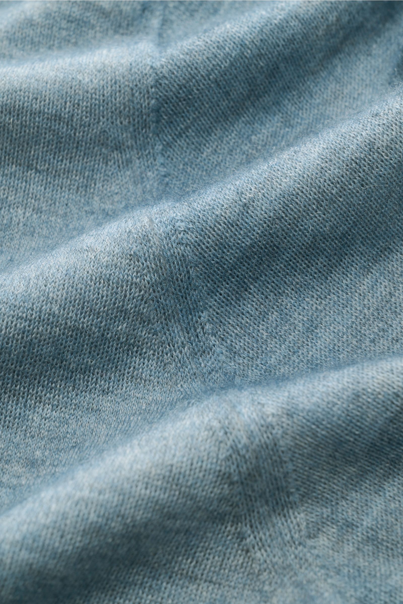 Close-up front view of the Colombo Cashmere crew neck jumper smoky blue showing fine, soft cashmere knit texture.

Make statement in stylish elegance: This jumper by COLOMBO in exquisite cashmere feels as light as a feather in the finest handcrafted fa