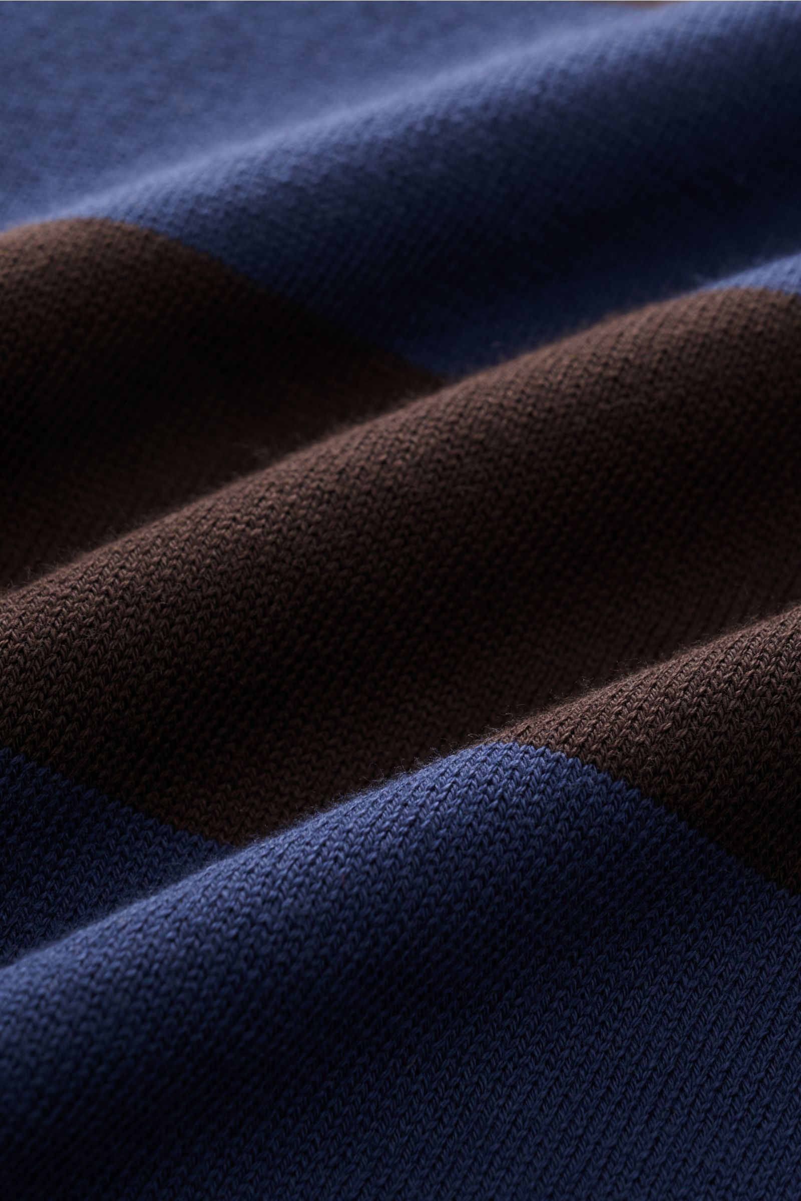 Close-up fabric detail of B.F. Knitwear Crew neck jumper navy/dark brown striped showing fine knit cotton with soft, elastic rib knit bands.

Description: Lightweight summer knit by experts B.F. KNITWEAR: This fine knit crew neck jumper in cotton with 
