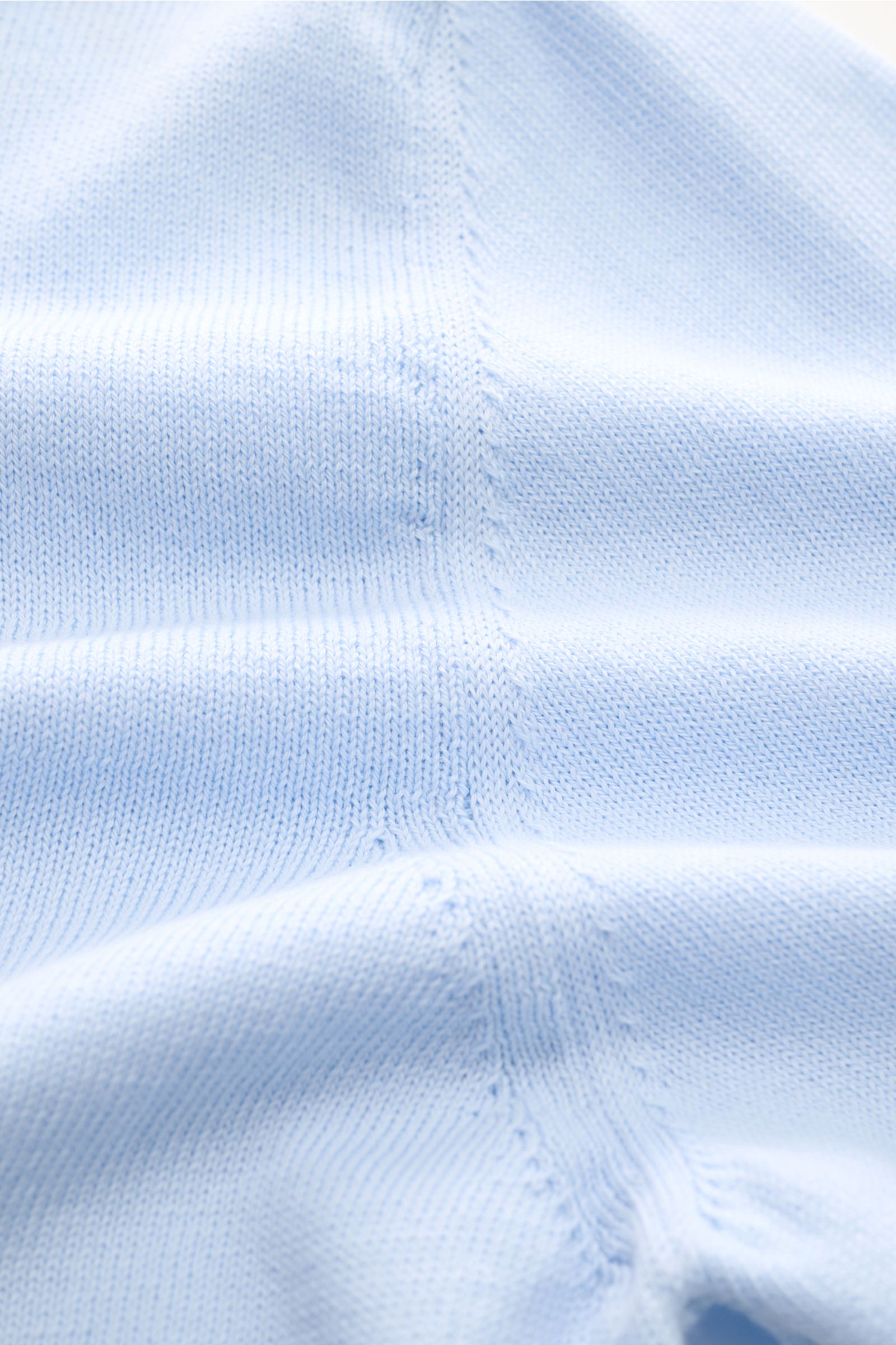Close-up front view of B.F. Knitwear Crew neck jumper light blue showing fine knit, soft pure cotton fabric, slim fit, ribbed bands, and crew neck details.