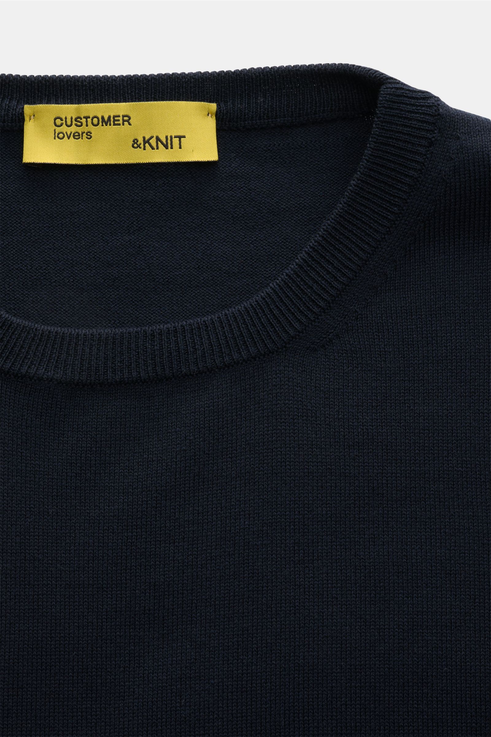 Close-up front view of B.F. Knitwear Crew neck jumper dark navy, showcasing pure cotton fine knit with ribbed bands and slim fit.

A versatile essential for spring: This crew neck jumper in pure cotton by B.F. KNITWEAR enhances any wardrobe with a clea