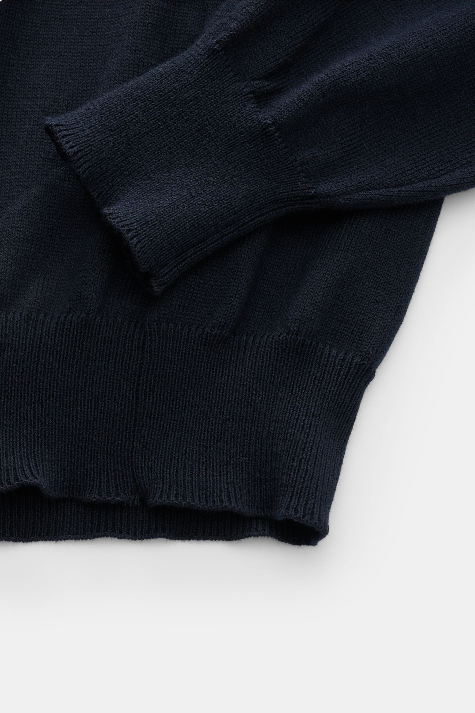 Close-up view of the B.F. Knitwear Crew neck jumper dark navy, showing fine knit, soft pure cotton fabric, slim fit, crew neck, and ribbed bands at sleeve and hem. A versatile essential for spring with a clean, timeless aesthetic.