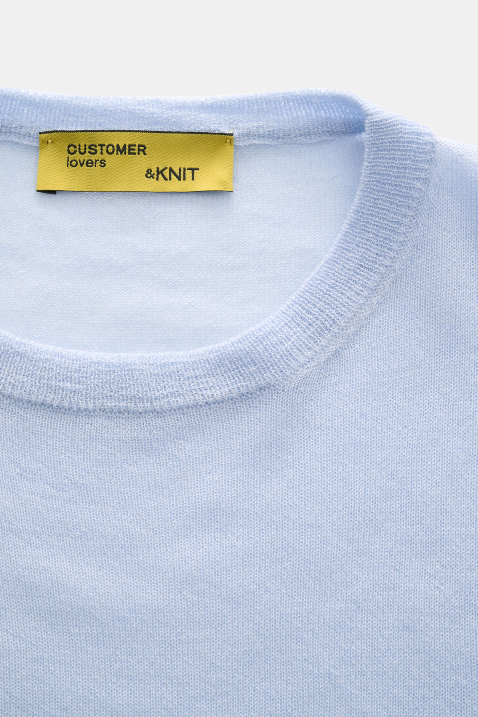 Close-up front view of B.F. Knitwear Cashmere crew neck jumper light blue showing fine, airy knit and elasticated rib knit crew neck band.

Lightweight summer cashmere from knitwear experts B.F. KNITWEAR: enhance your spring wardrobe with a durable, It