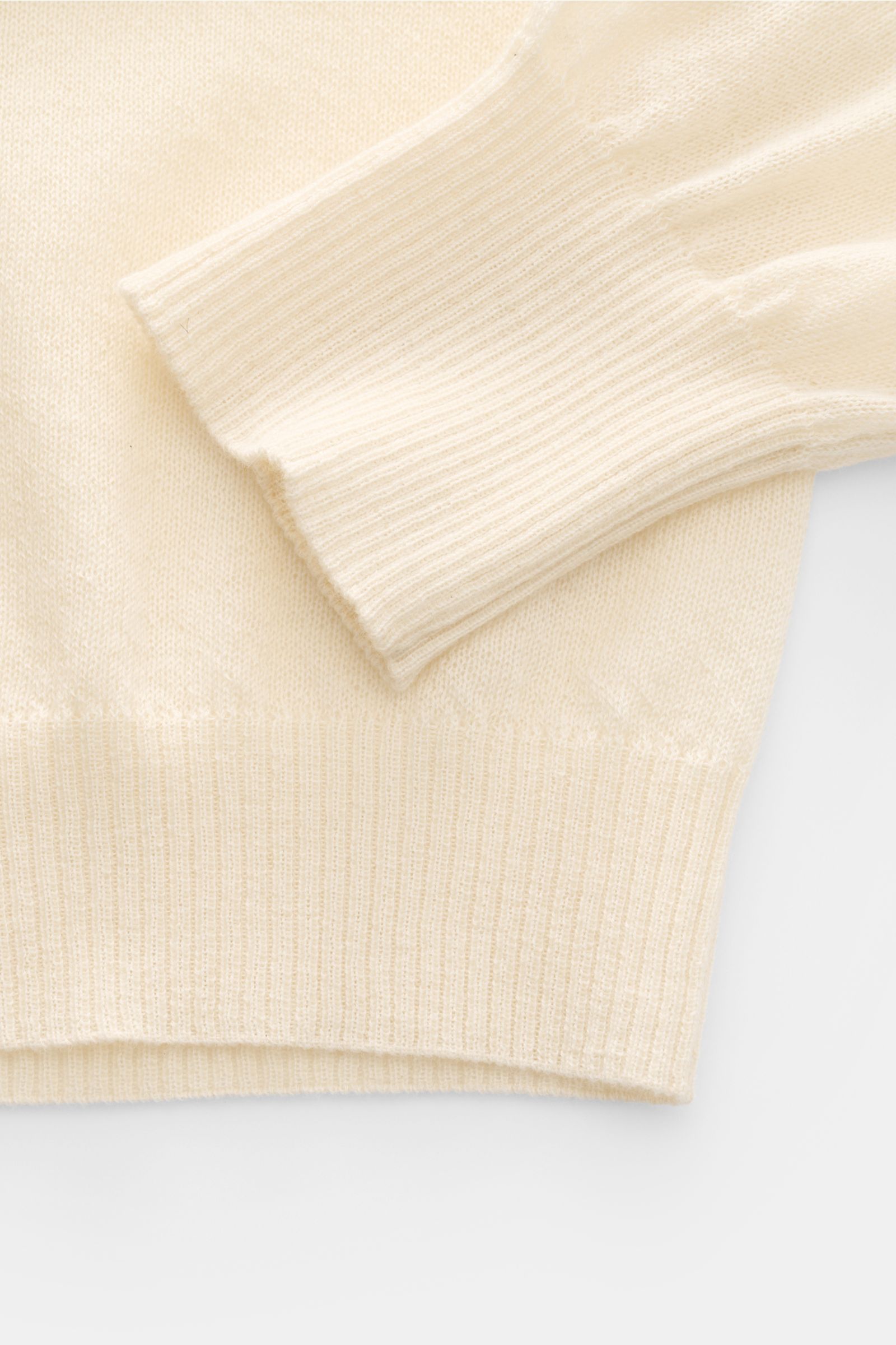 Close-up front view of B.F. Knitwear Cashmere crew neck jumper cream, showing fine, airy knit and elasticated rib knit bands on sleeve and hem.

Lightweight summer cashmere from knitwear experts B.F. KNITWEAR: enhance your spring wardrobe with a durabl