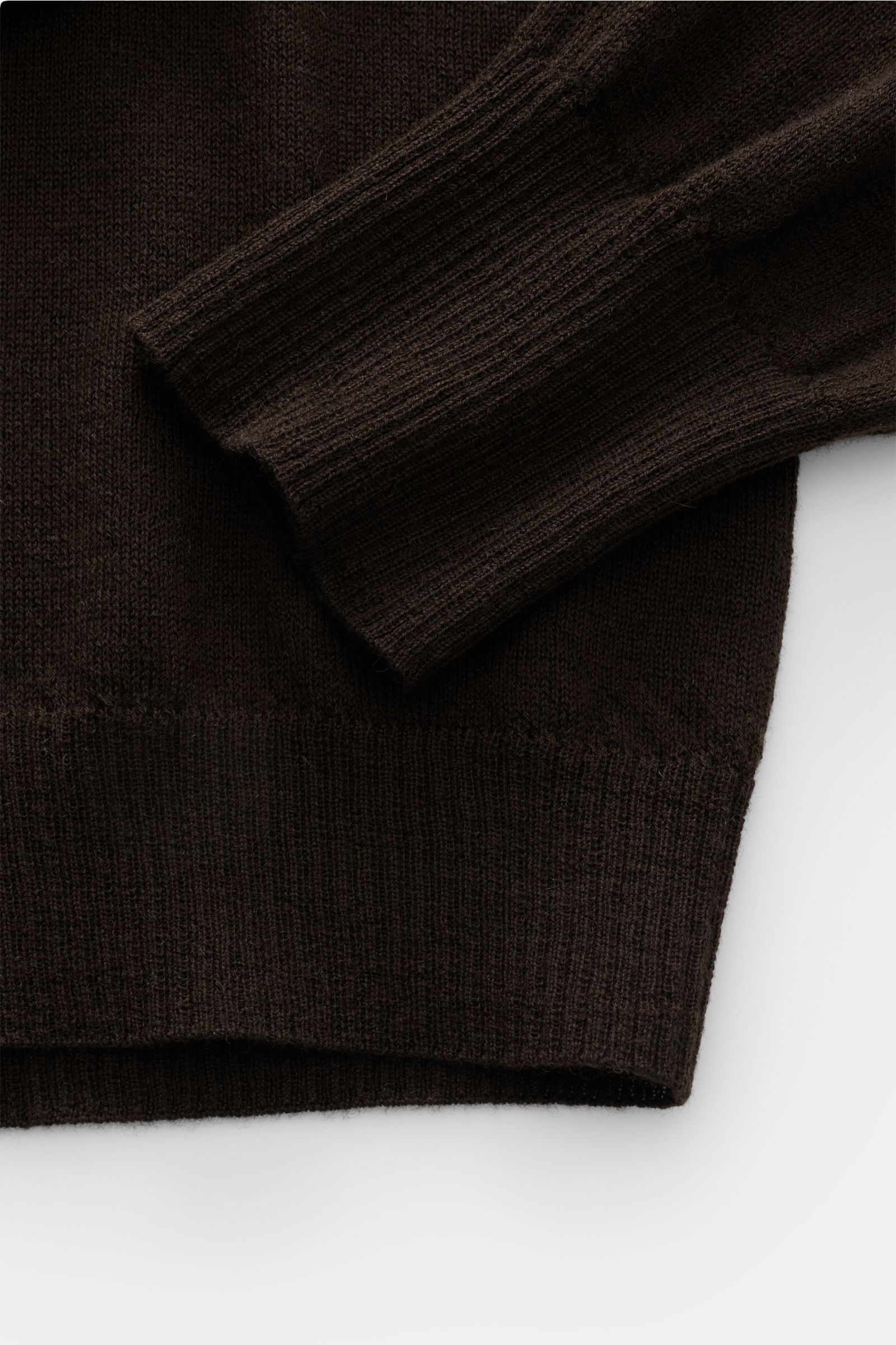 Close-up top-down view of the B.F. Knitwear Cashmere crew neck jumper dark brown showing fine, airy knit, elasticated rib knit bands on cuff and hem.

Description: Lightweight summer cashmere from knitwear experts B.F. KNITWEAR: enhance your spring wardro