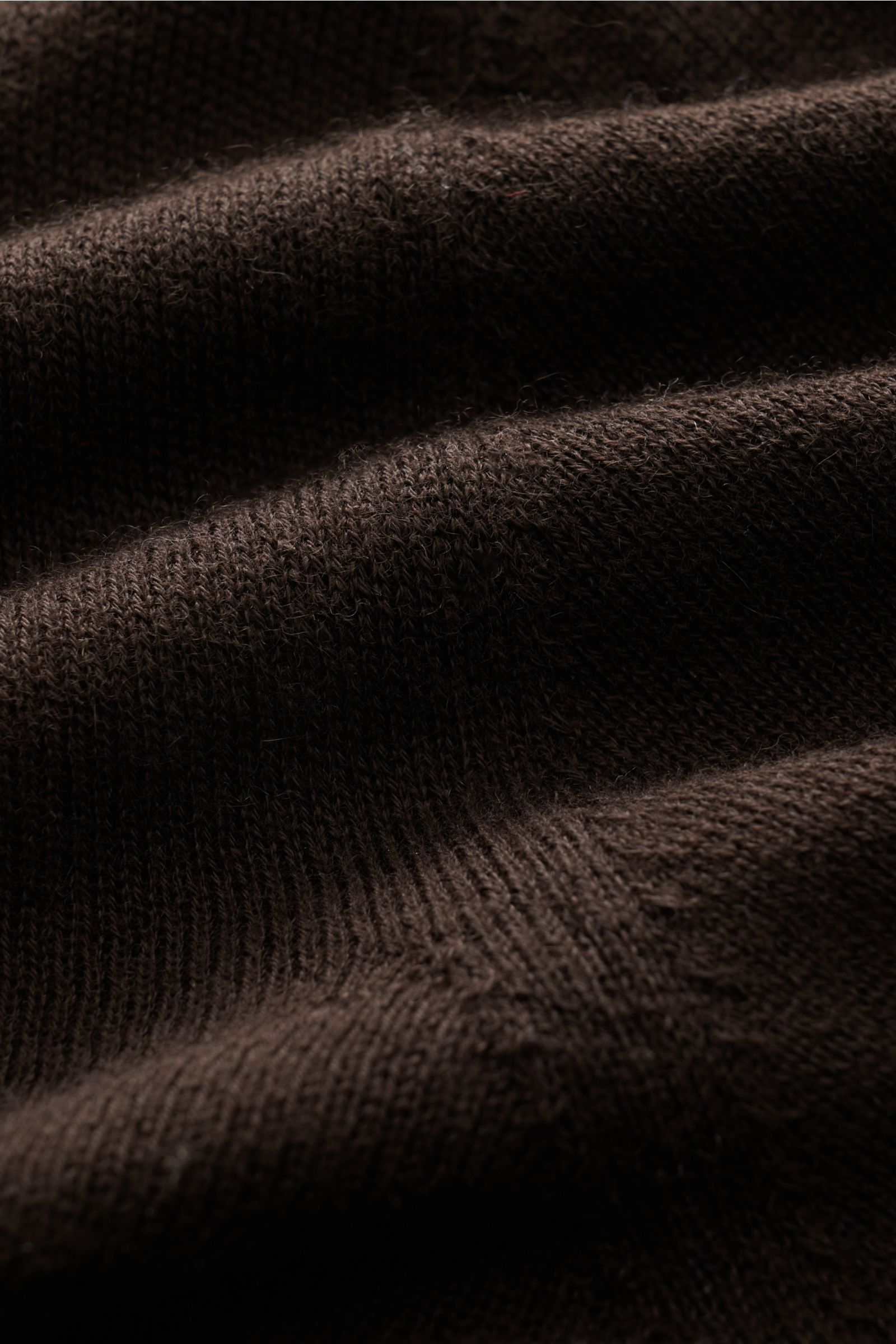 Close-up front perspective of B.F. Knitwear Cashmere crew neck jumper dark brown showing fine, airy knit texture and soft feel.

Lightweight summer cashmere from knitwear experts B.F. KNITWEAR: enhance your spring wardrobe with a durable, Italian-made 