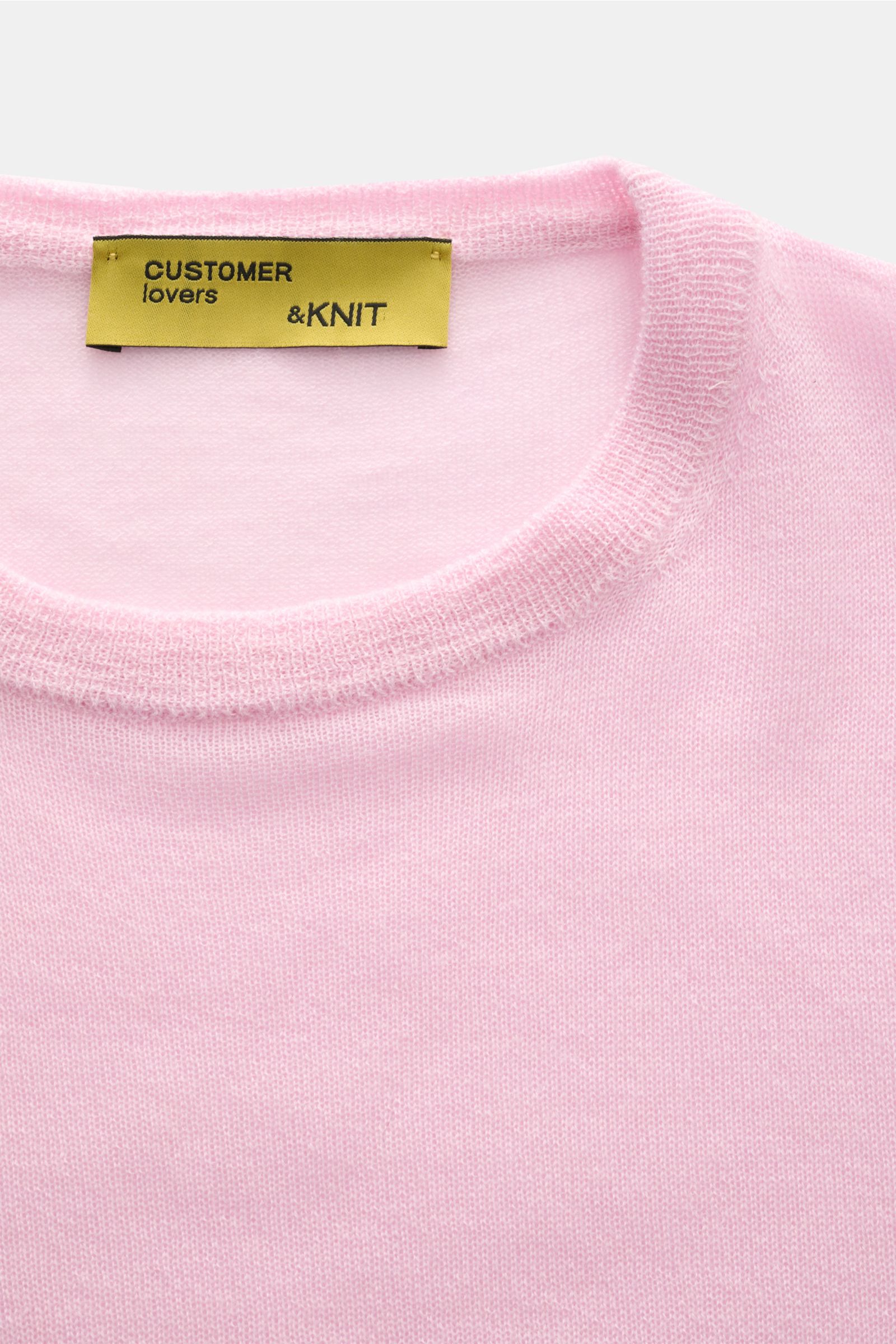 Close-up, top-down view of the B.F. Knitwear Cashmere crew neck jumper rose, showing fine, airy knit fabric and elasticated rib knit bands.

Description: Lightweight summer cashmere from knitwear experts B.F. KNITWEAR: enhance your spring wardrobe with