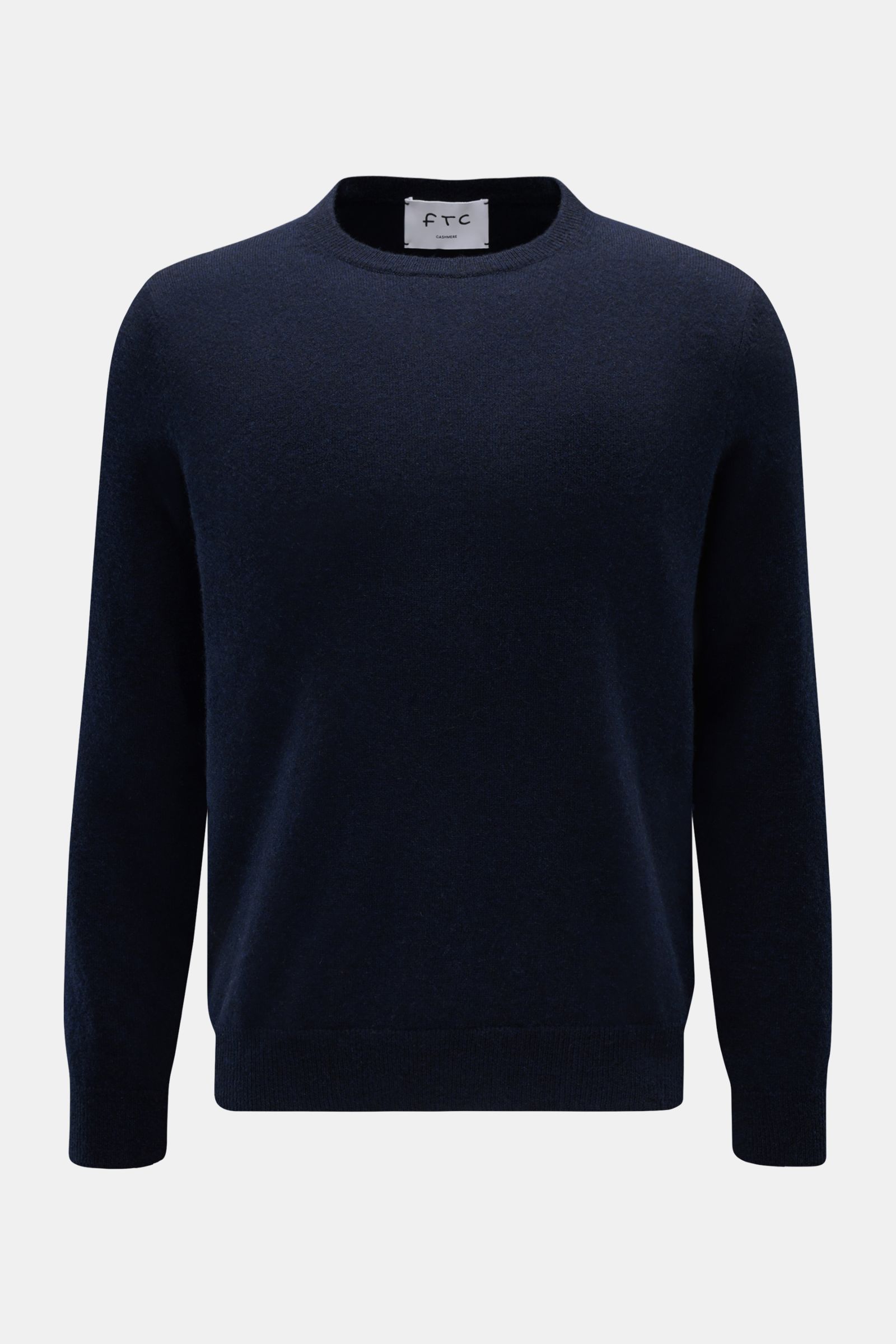 Front view of FTC Cashmere crew neck jumper navy, made of pure cashmere with a very soft feel, fine knit, slim fit, crew neck, and comfortable ribbed bands. 

Description: The feel of ultra soft cashmere fabric makes this timeless crew neck jumper by s